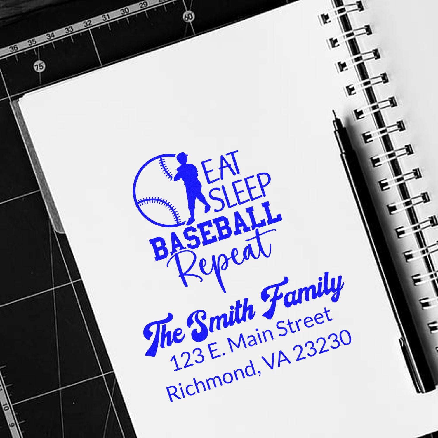 Custom baseball rubber stamp design with Eat Sleep Baseball Repeat and The Smith Family return address on a notebook page.