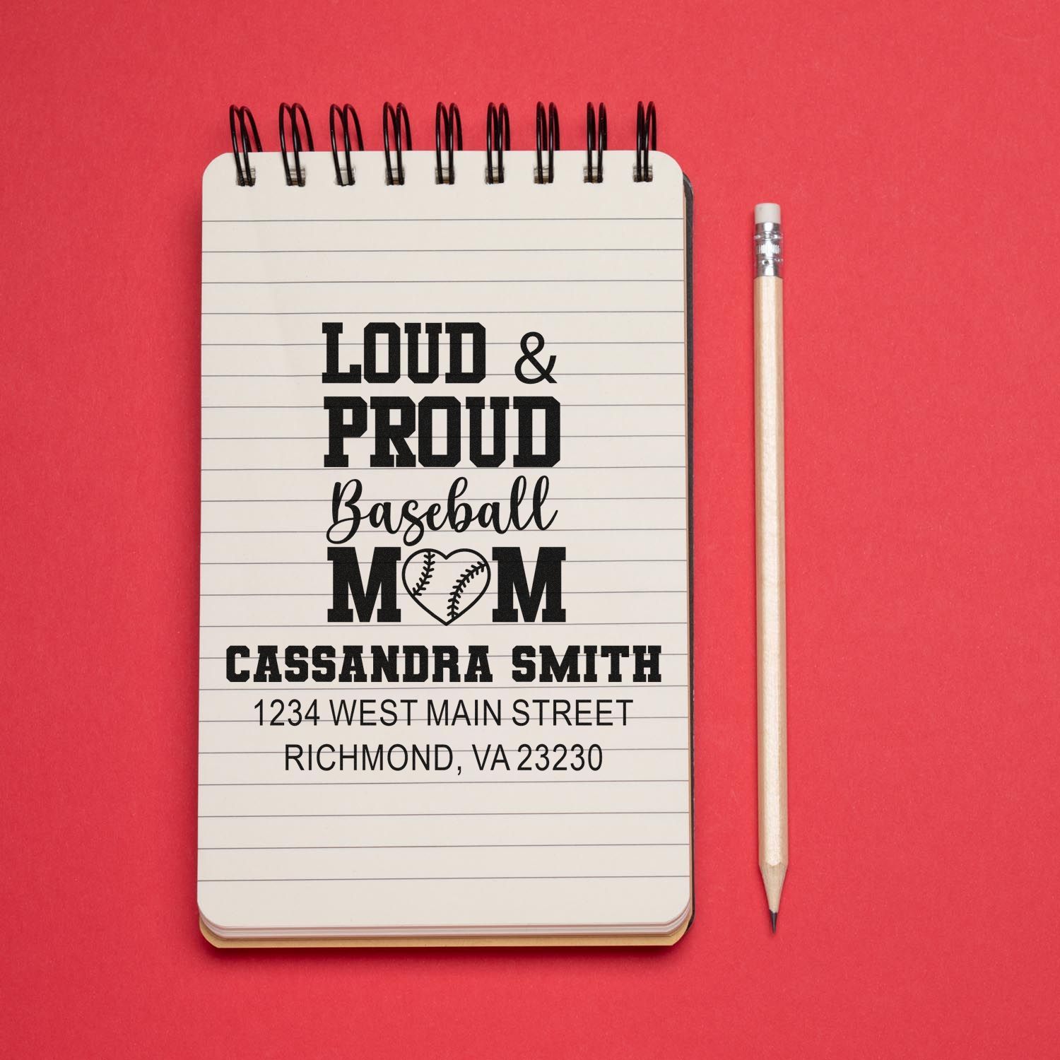 Custom baseball mom rubber stamp mockup with personalized name and address on notebook
