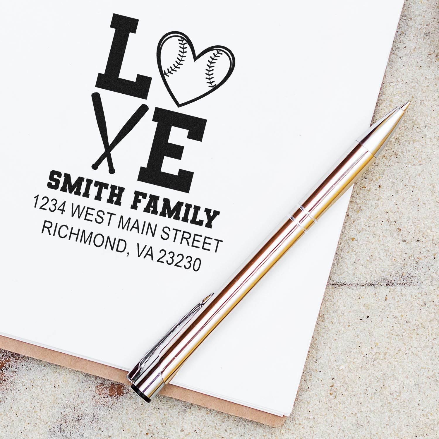 Custom family address rubber stamp with baseball heart design for personalized stationery and envelopes.