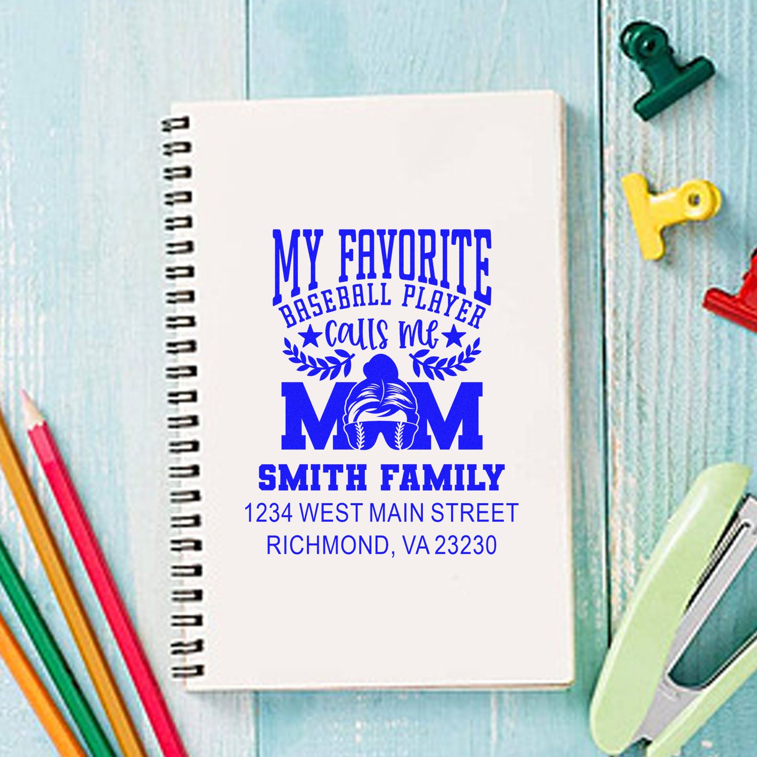 Personalized baseball mom rubber stamp on notebook with family name and address for custom stationery and gifts.