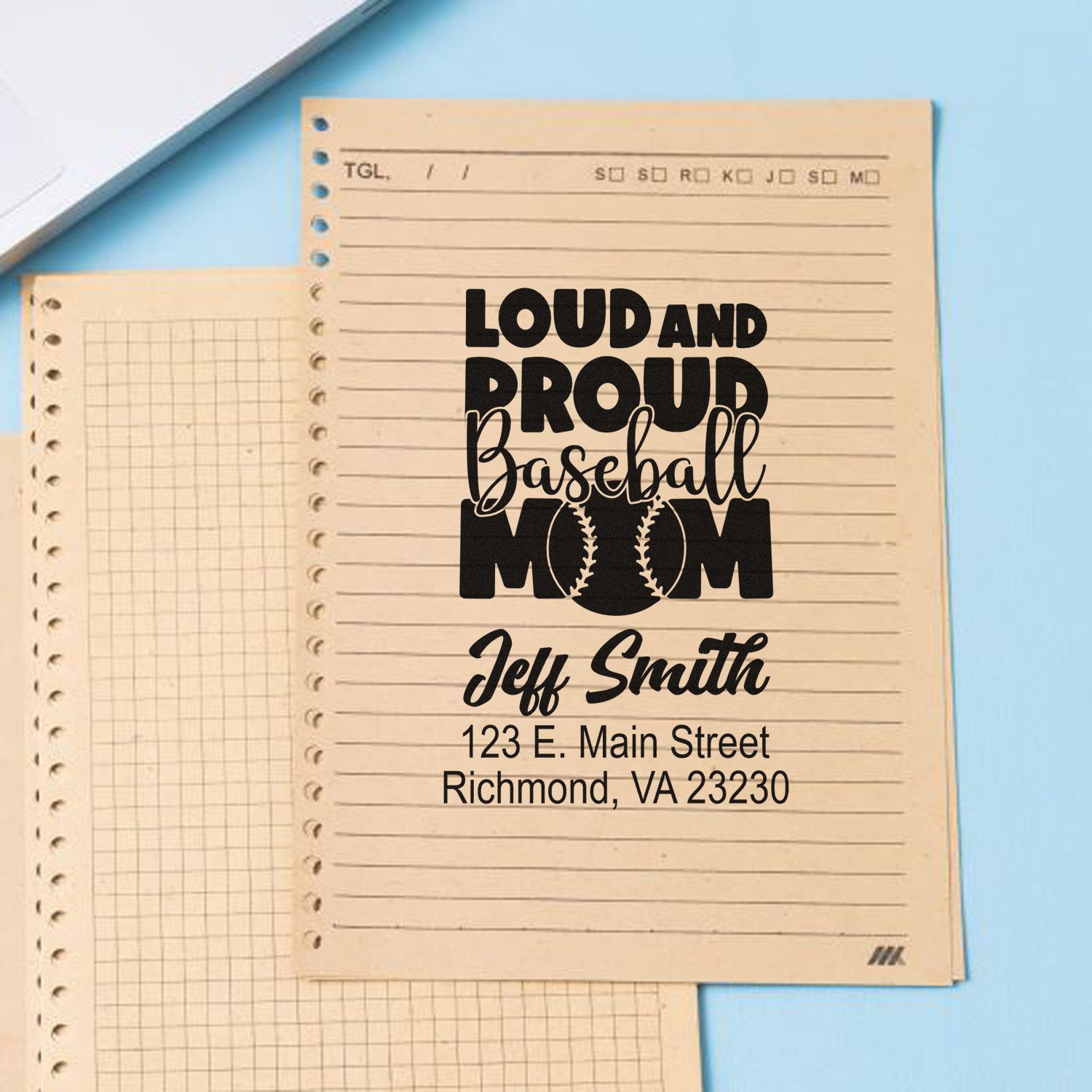Custom baseball mom rubber stamp design with name and address, shown on notebook paper for personalized sports stationery.