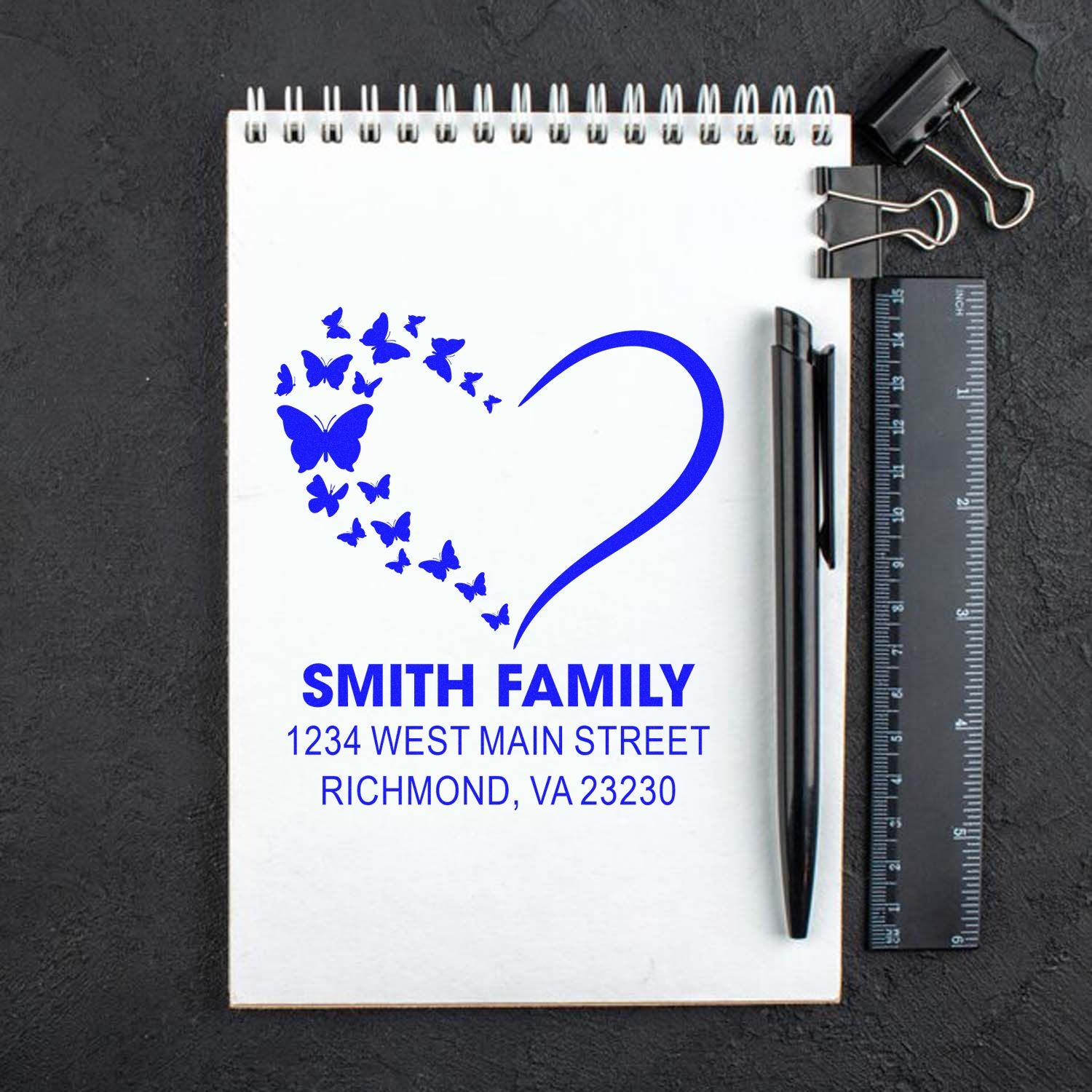 Custom butterfly heart return address rubber stamp for Smith Family with personalized mailing address and decorative design.