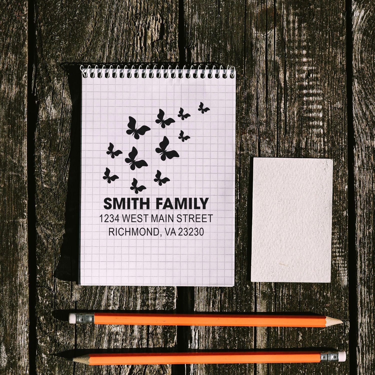 Personalized return address rubber stamp with butterfly design for Smith family envelopes and stationery.