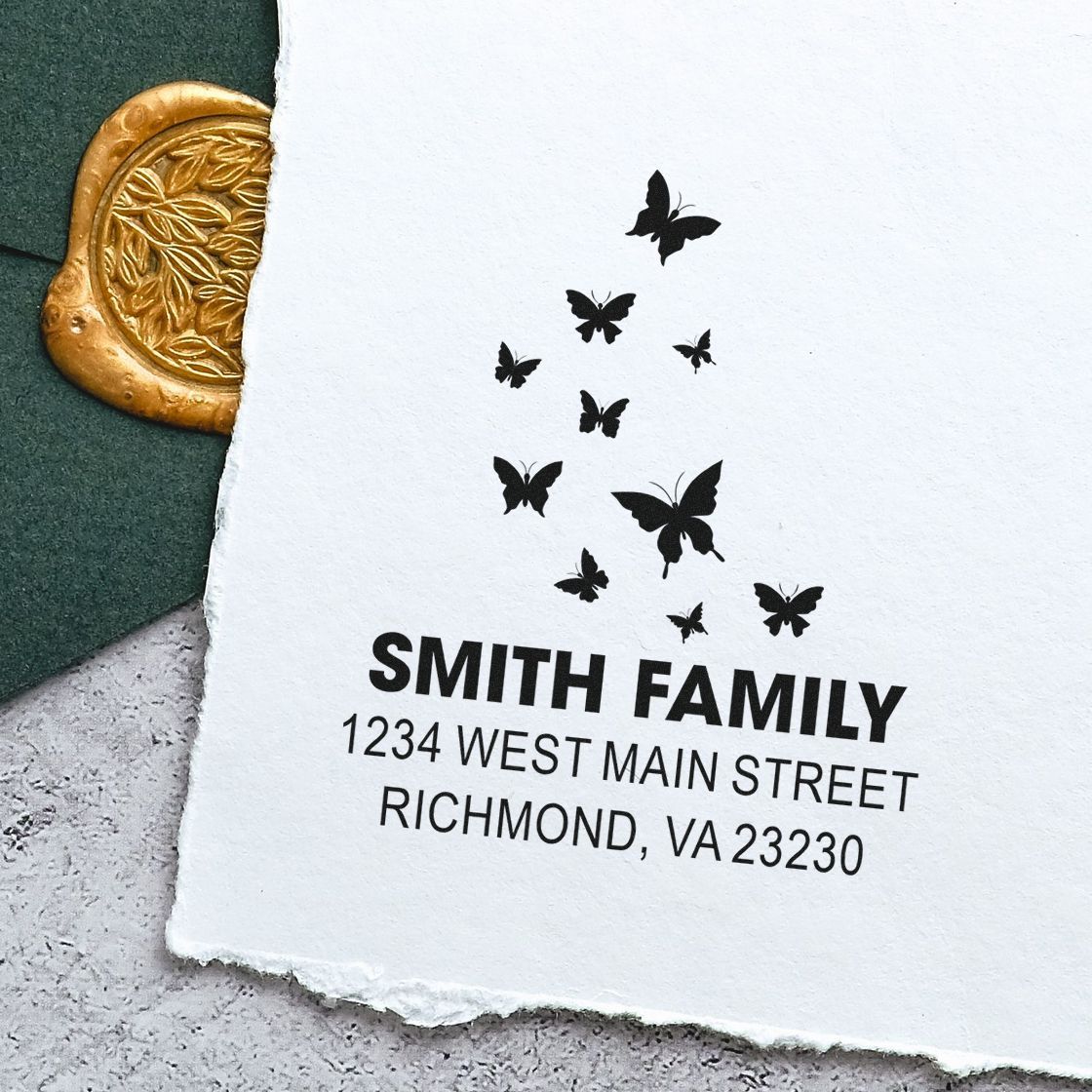 Custom butterfly return address rubber stamp for Smith Family, with personalized name and Richmond, VA address.