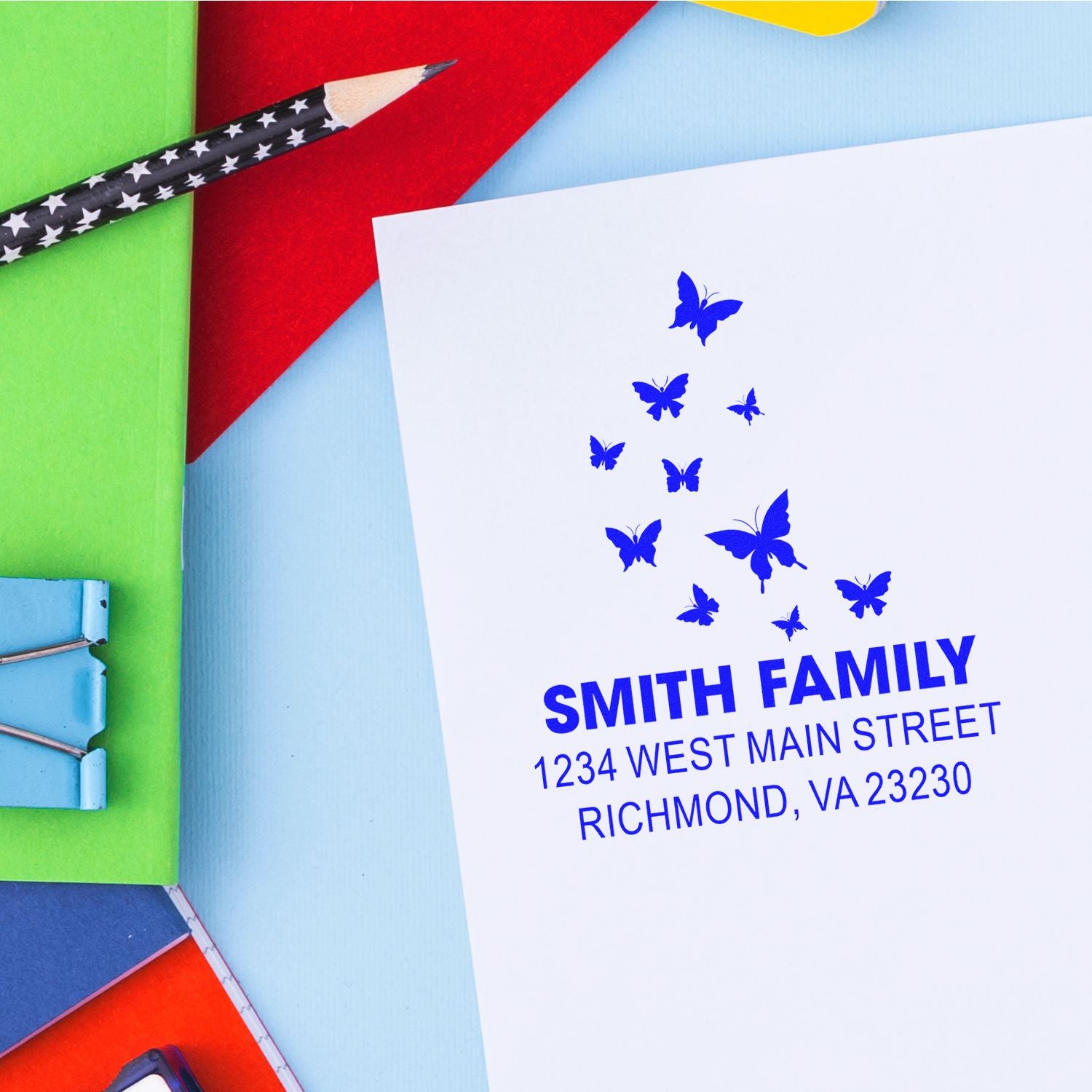 Custom butterfly return address rubber stamp for family mail, featuring name and address imprint.