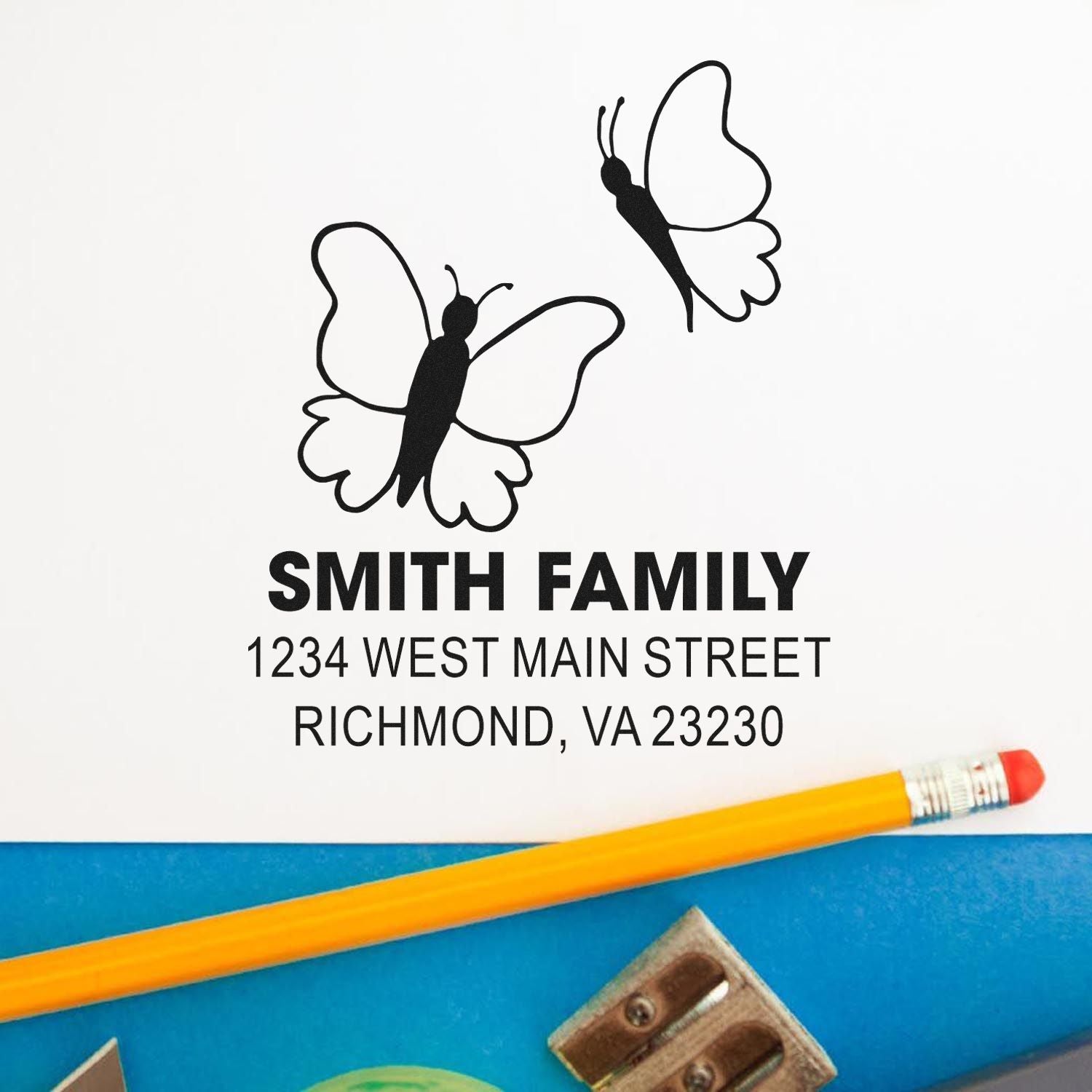 Custom butterfly family address rubber stamp with Smith Family name and Richmond, VA return address.
