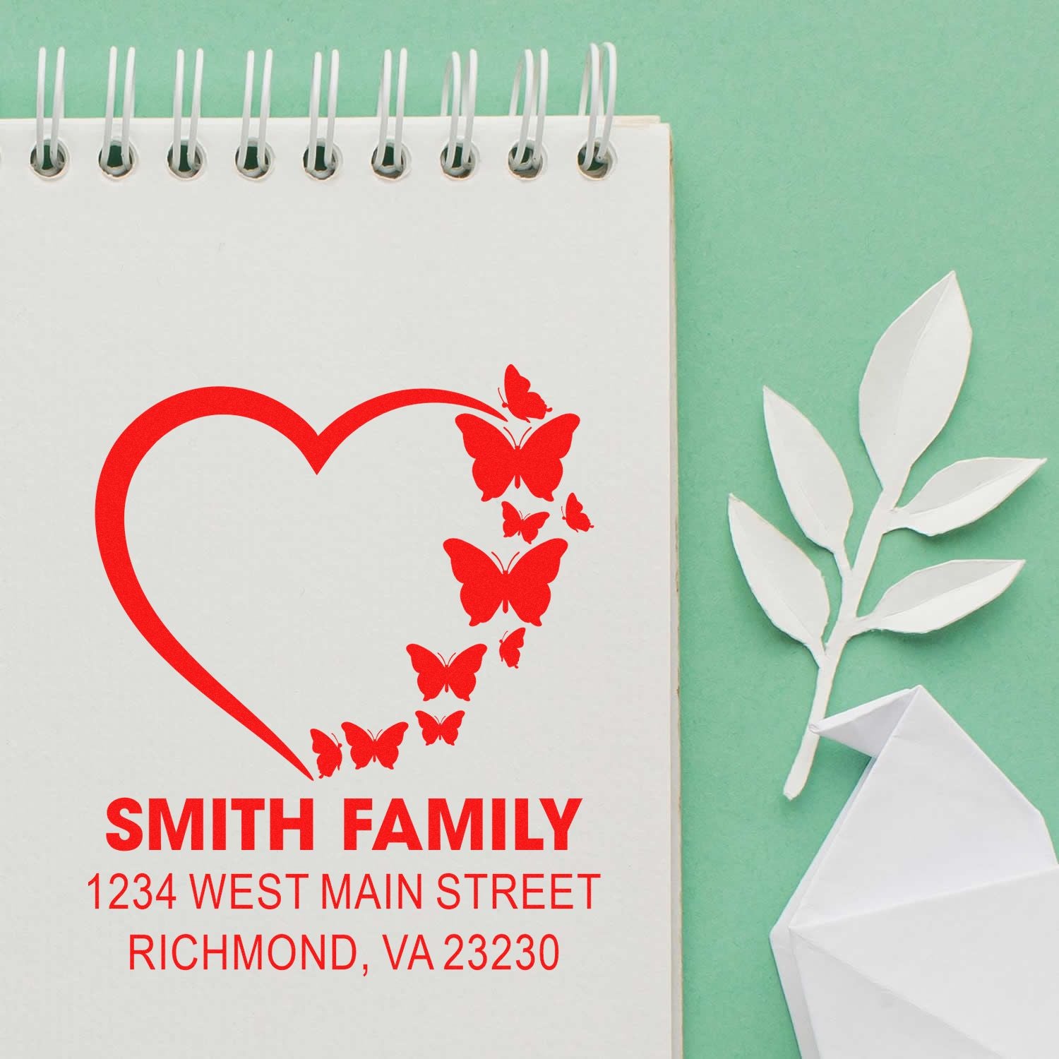 Custom return address rubber stamp with heart and butterflies for Smith Family, Richmond, VA 23230.