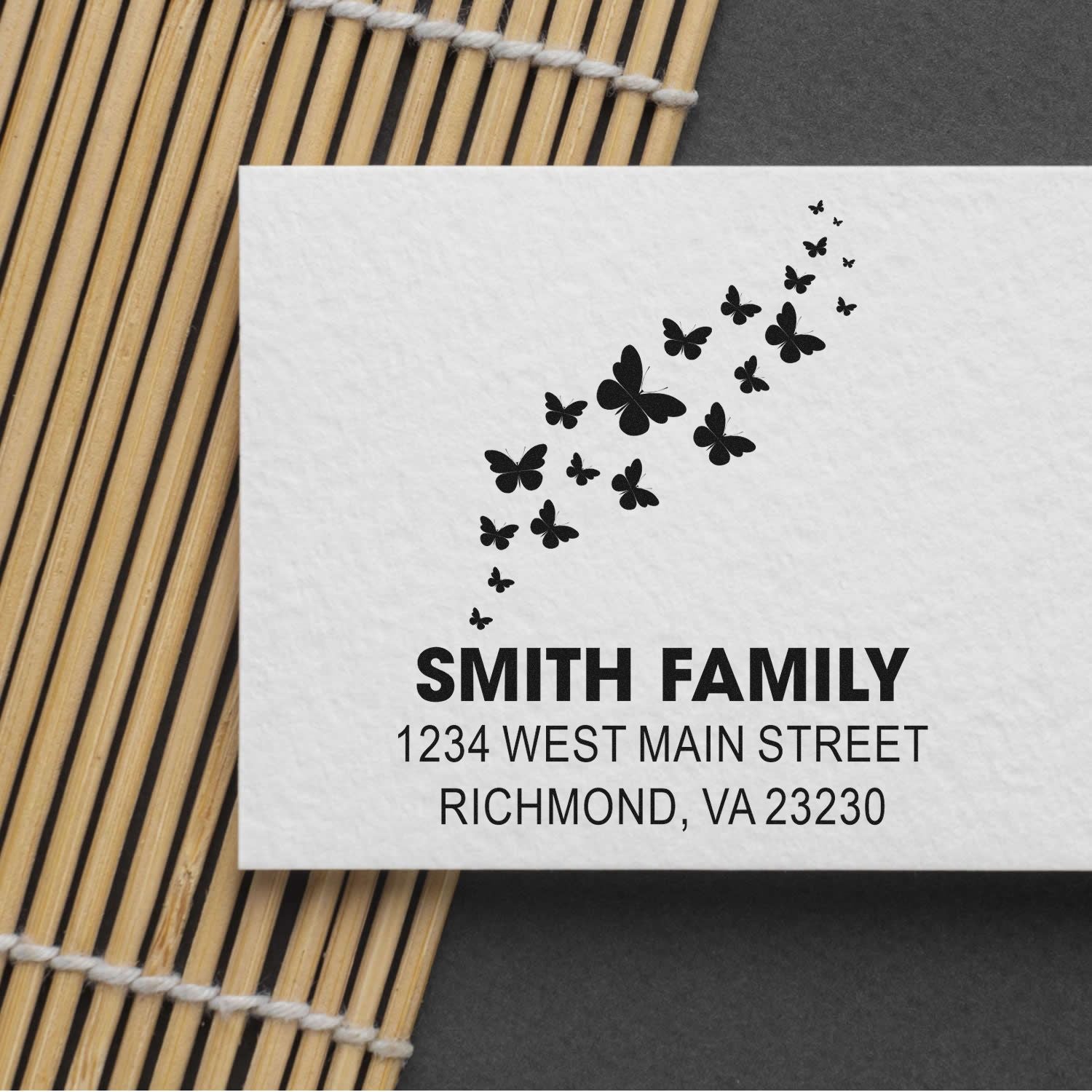 Custom butterfly address rubber stamp for Smith Family with Richmond, VA 23230 return address.