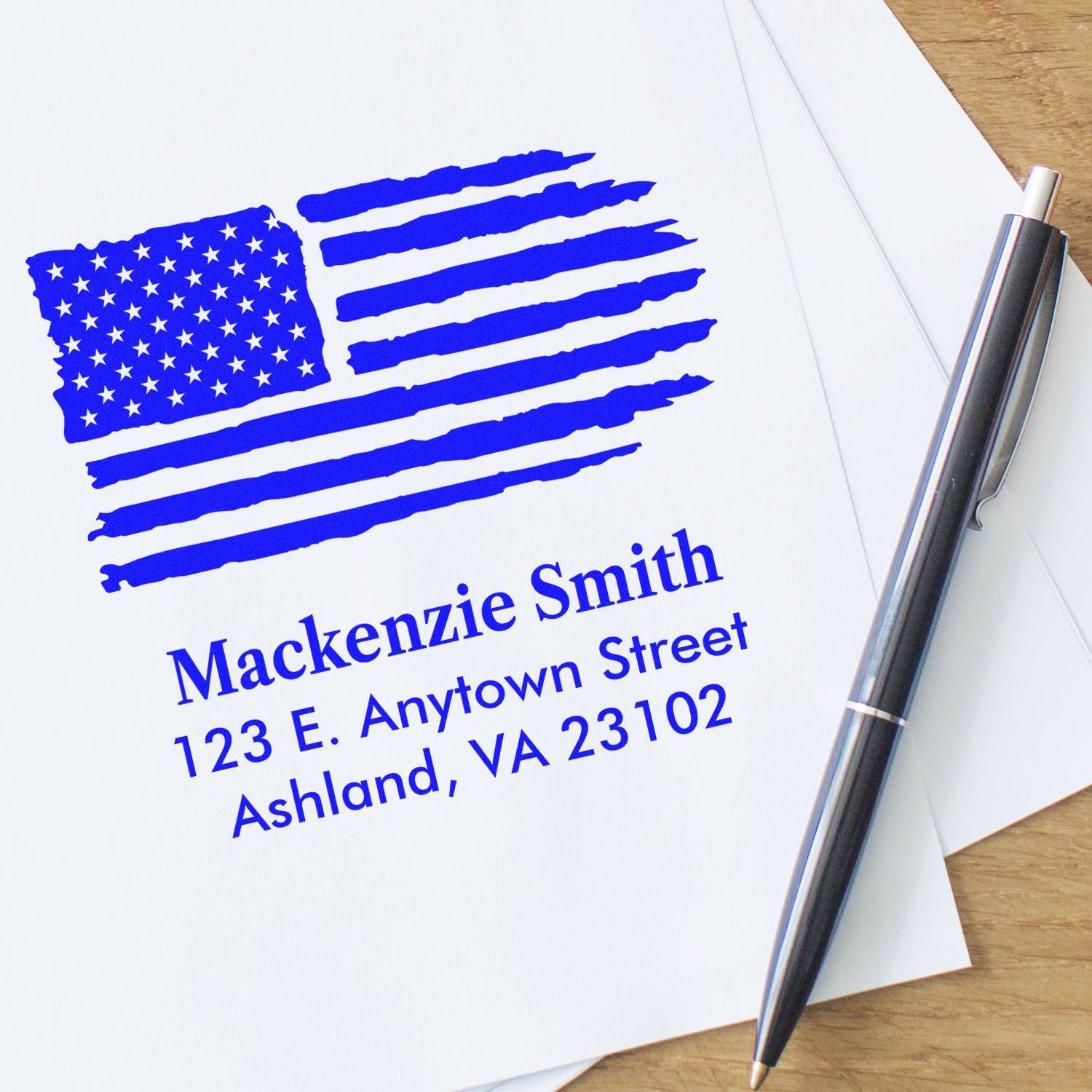 Custom patriotic address rubber stamp with distressed American flag and return address for Mackenzie Smith, Ashland, VA.
