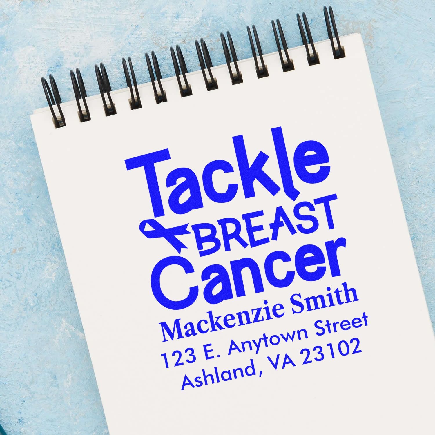 Custom breast cancer awareness rubber stamp reading Tackle Breast Cancer with ribbon, name, and address.