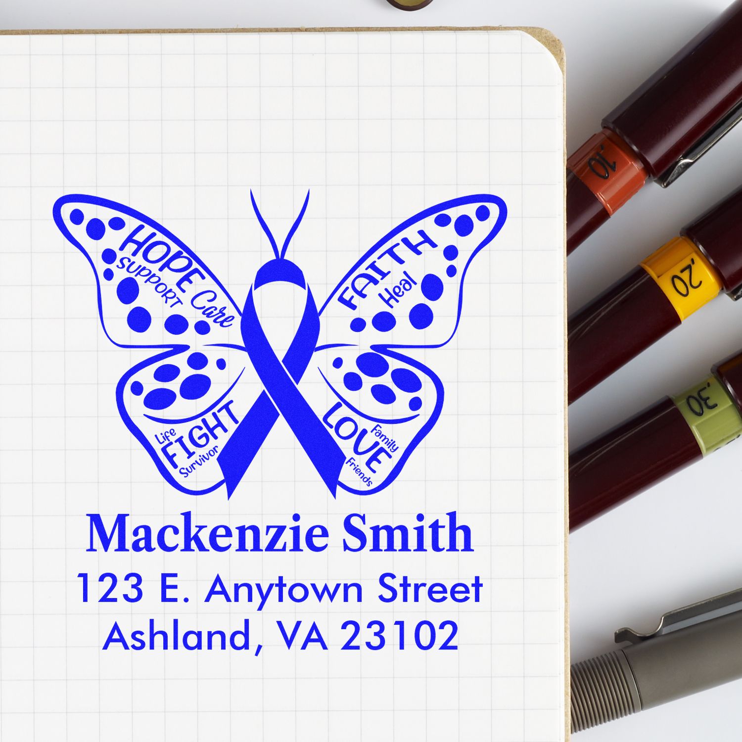 Custom butterfly cancer awareness rubber stamp with support ribbon and personalized name and address for cards or mailings.