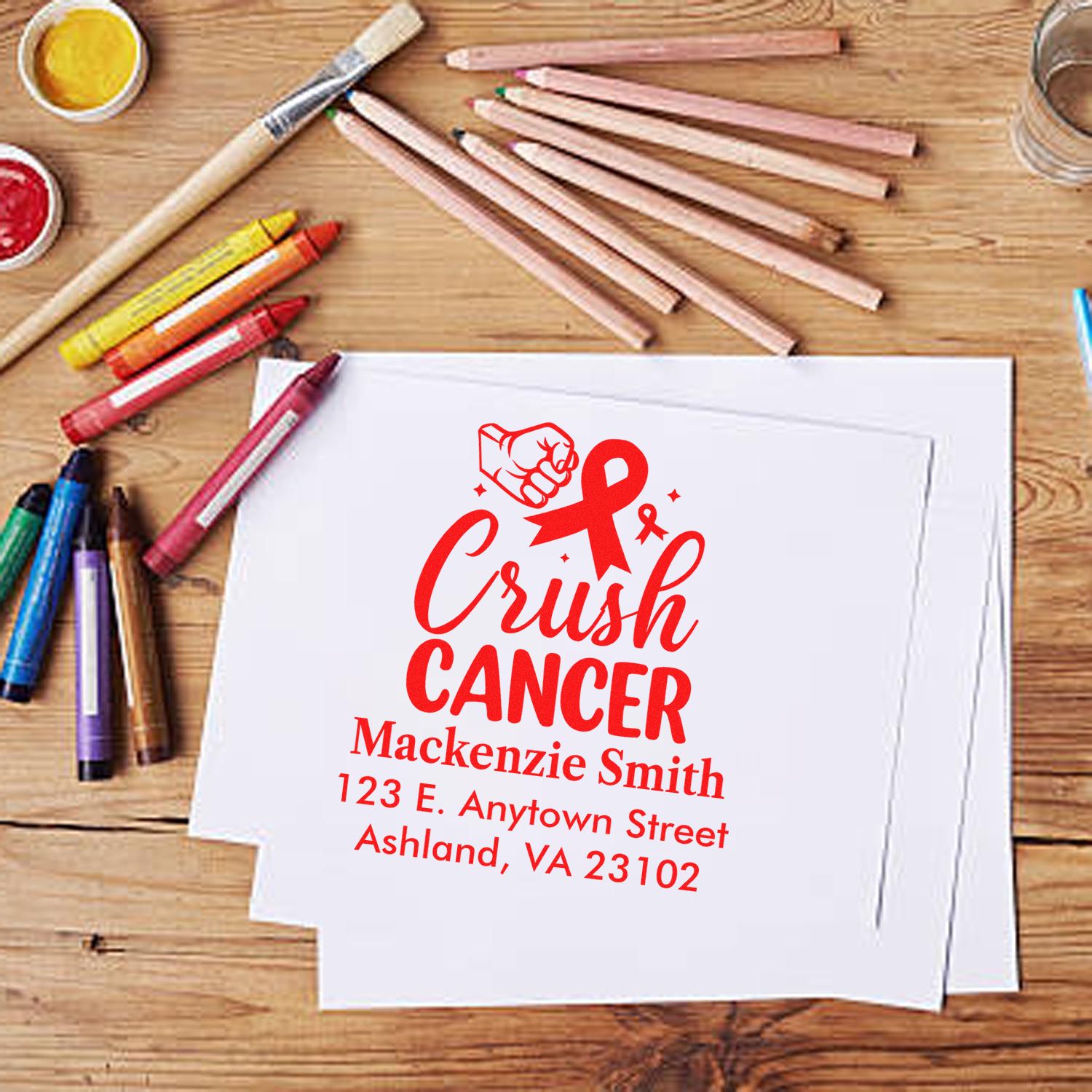 Custom Crush Cancer rubber stamp design with awareness ribbon, fist icon, and personalized name and address for fundraising.