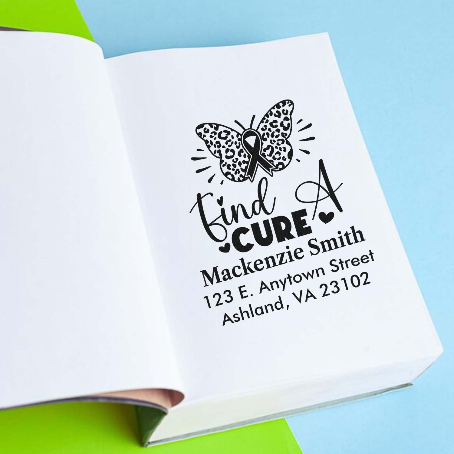 Custom rubber stamp with butterfly cancer ribbon, Find a Cure, and personalized return address.