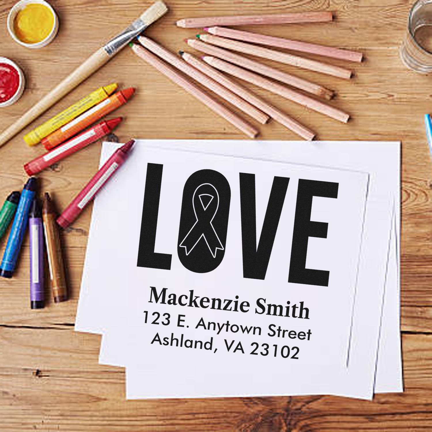 Custom rubber stamp design with LOVE ribbon and return address for personalized cards, stationery, and handmade gifts.