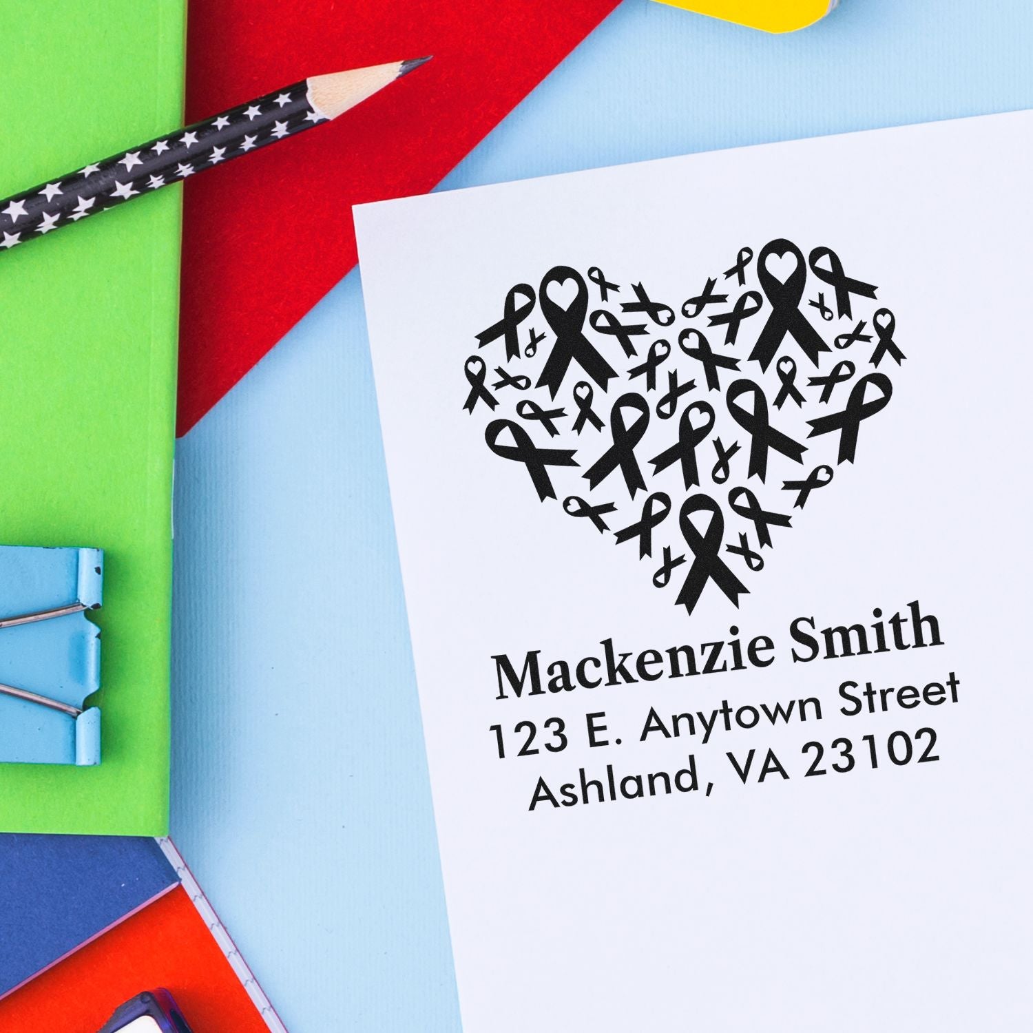 Personalized return address rubber stamp with ribbon heart design for awareness mailings.