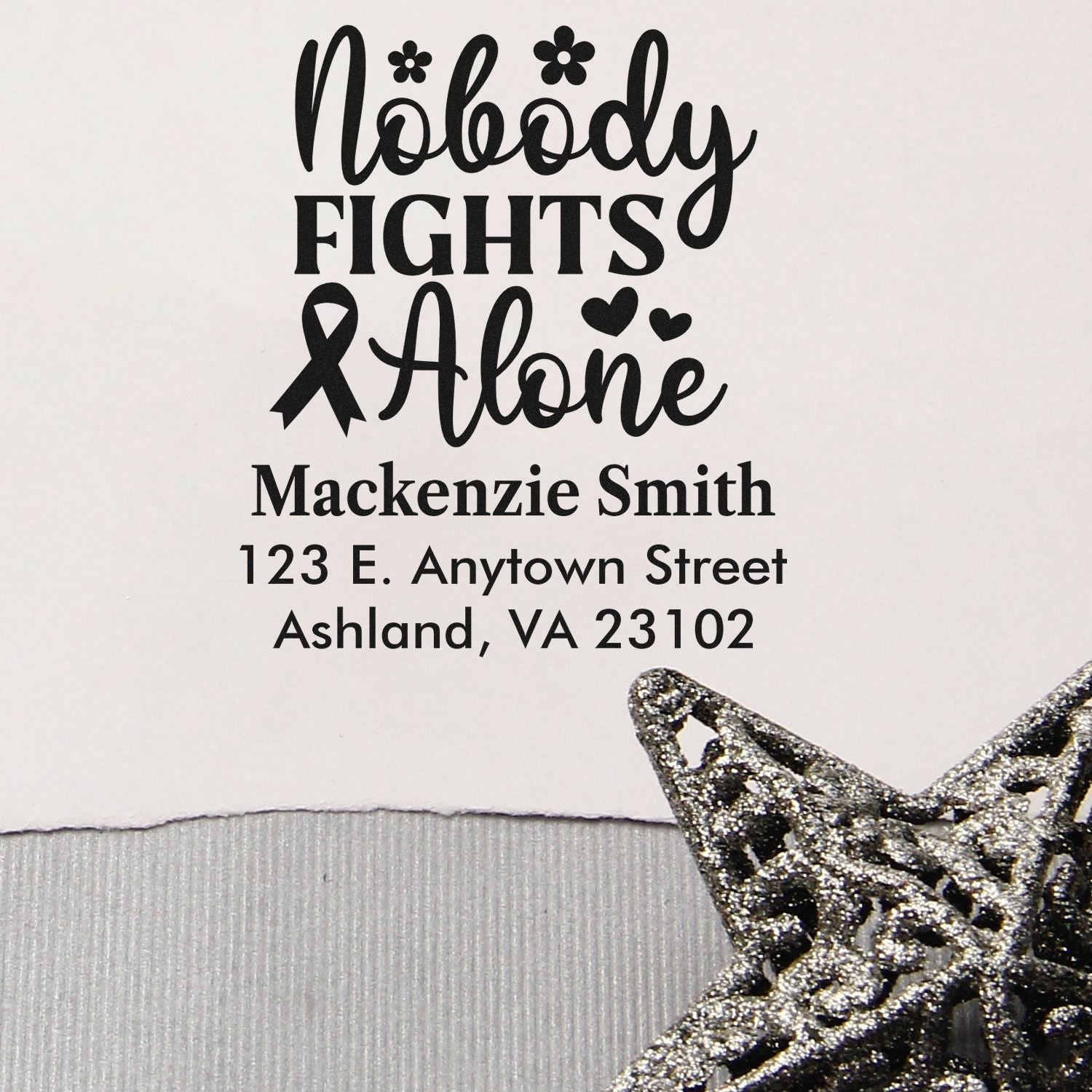 Personalized rubber stamp with Nobody Fights Alone ribbon design, hearts, and custom name and address.