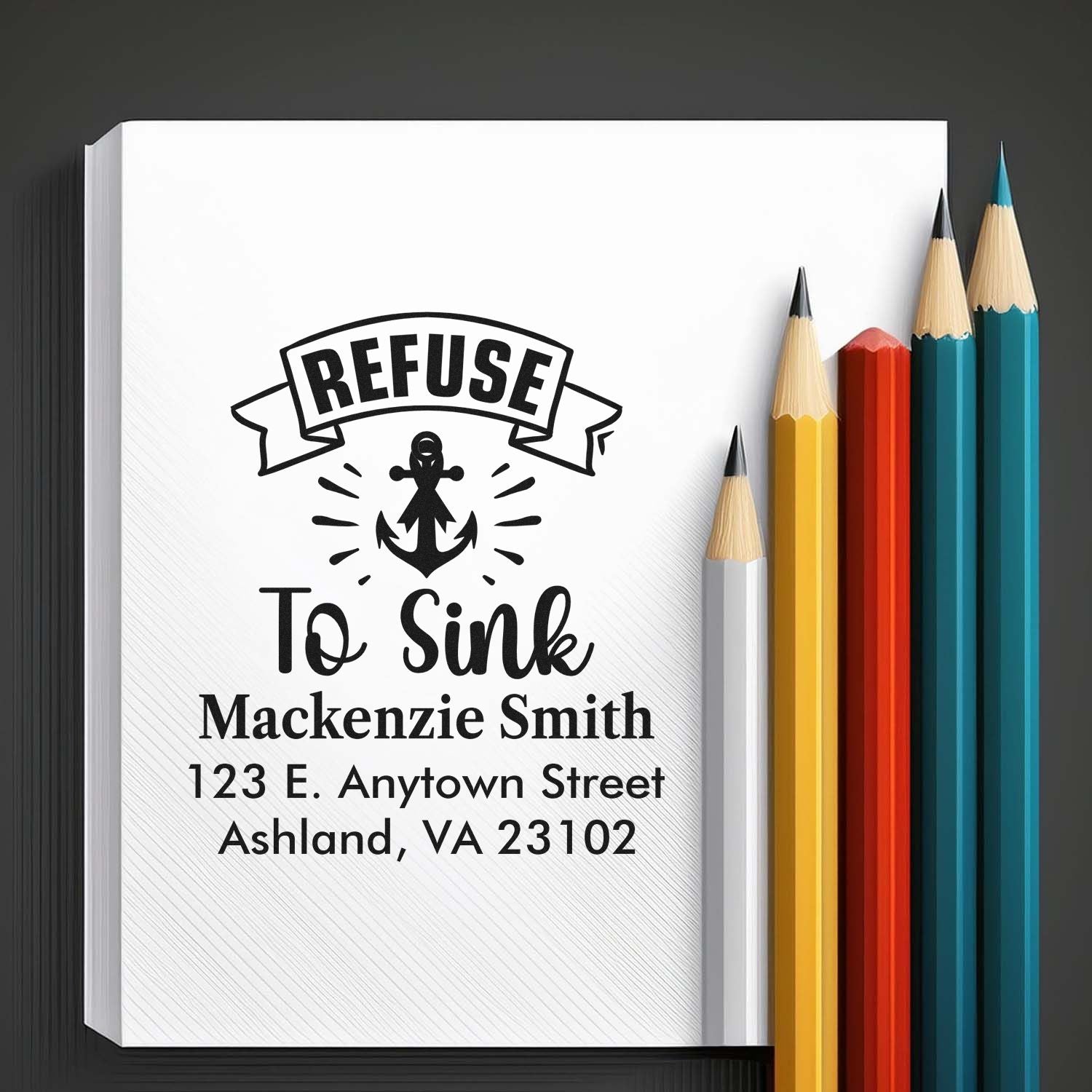 Custom rubber stamp design with Refuse to Sink anchor and personalized name and address for notebooks or mail.