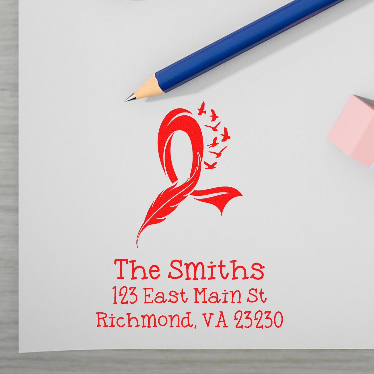 Personalized return address rubber stamp with red logo for The Smiths, 123 East Main St, Richmond, VA 23230