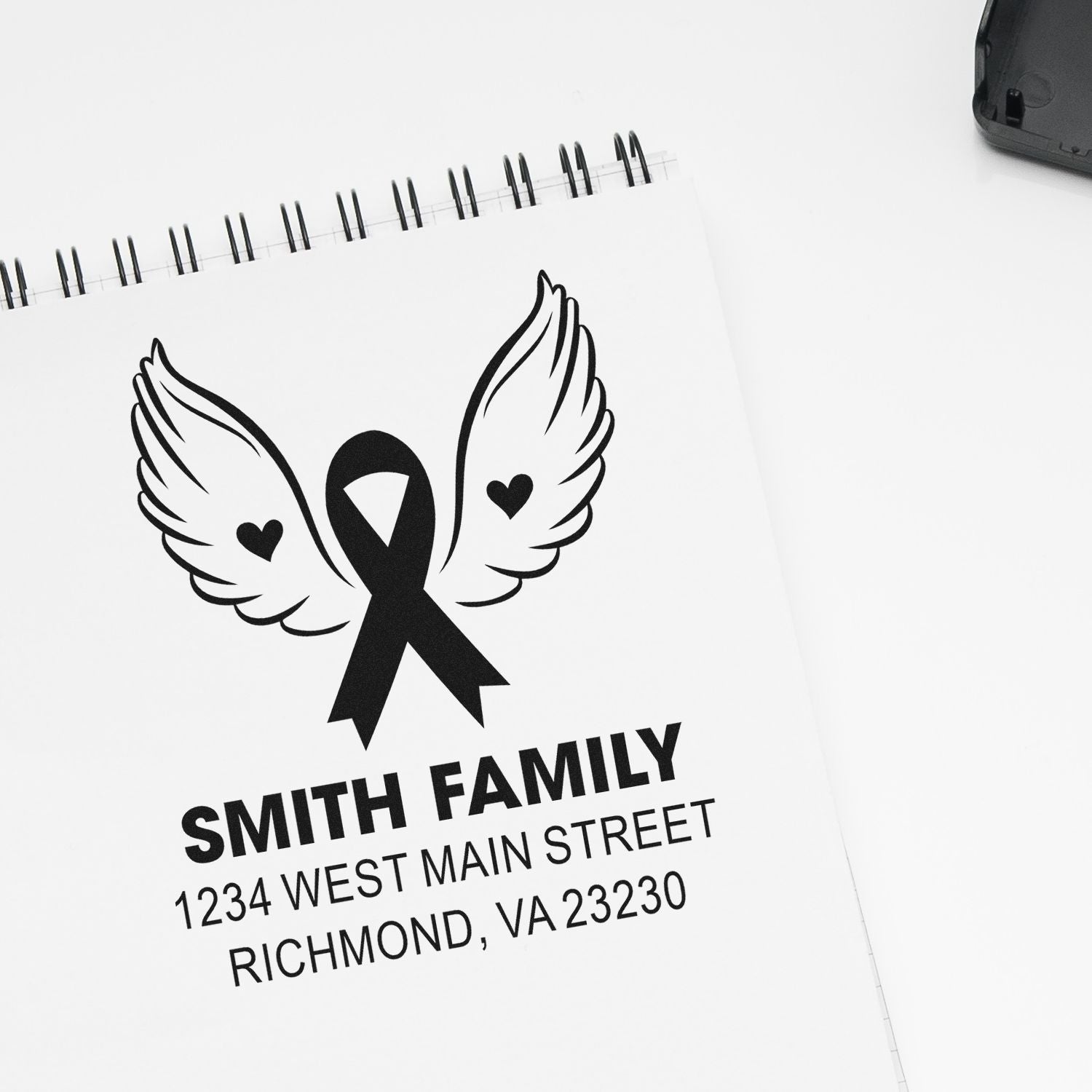 Custom family return address rubber stamp with winged ribbon design for Smith Family, Richmond, VA.