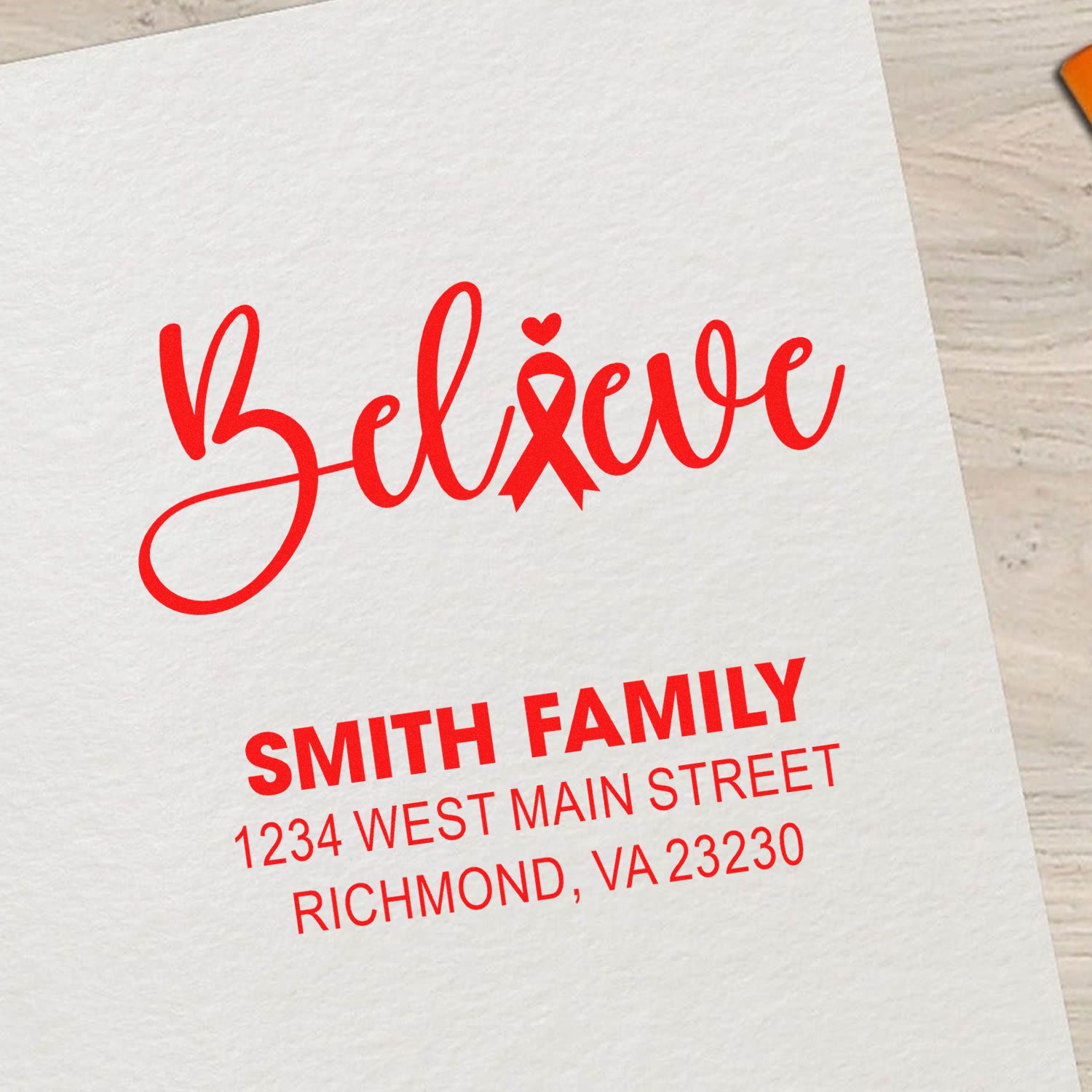 Custom Believe ribbon rubber stamp with Smith family return address for envelopes, cards, and awareness stationery