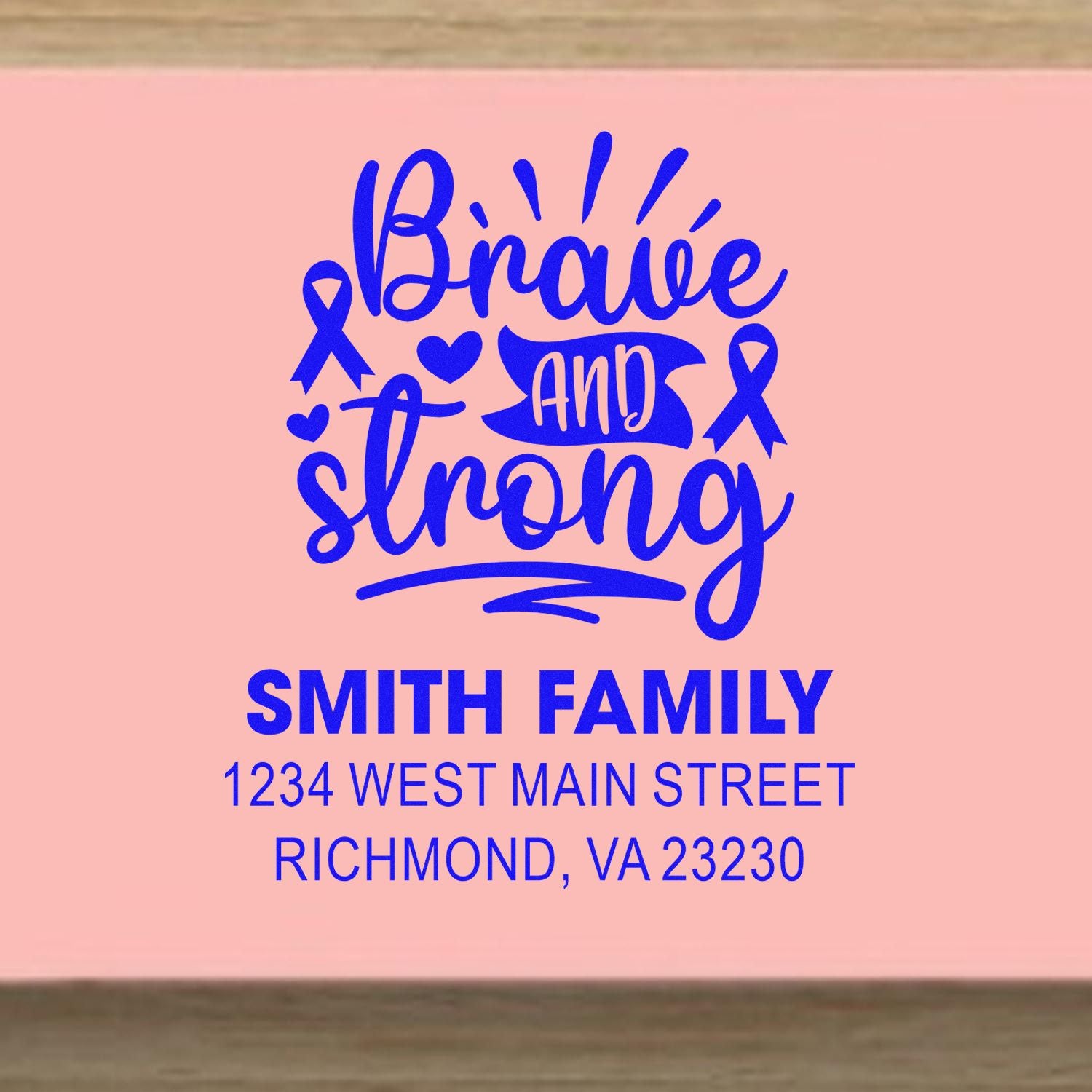 Custom rubber stamp with Brave and Strong, breast cancer ribbon art, and Smith family return address.