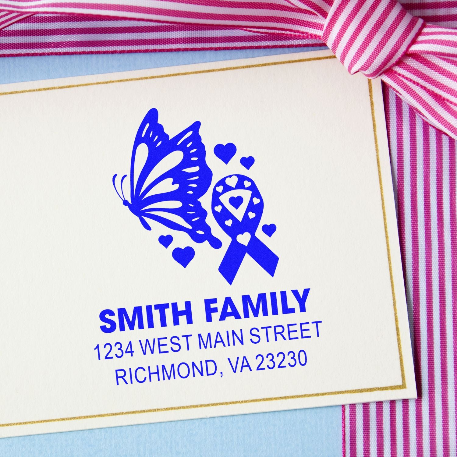 Custom rubber return address stamp with butterfly and breast cancer awareness ribbon for Smith family stationery
