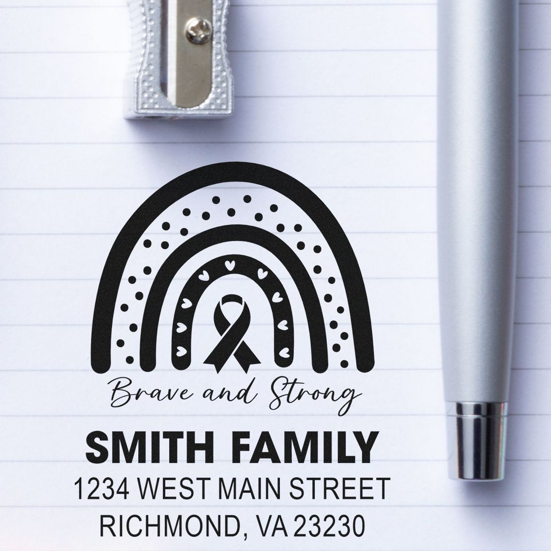 Custom rubber stamp with rainbow and ribbon, featuring Smith Family return address for awareness-themed stationery.