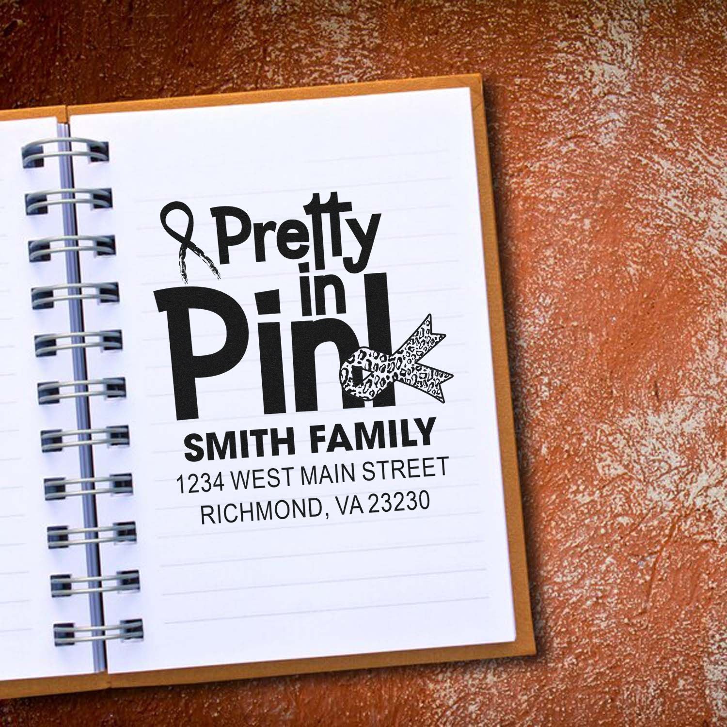 Custom Pretty in Pink rubber stamp with family name and address, ideal for breast cancer awareness gifts.