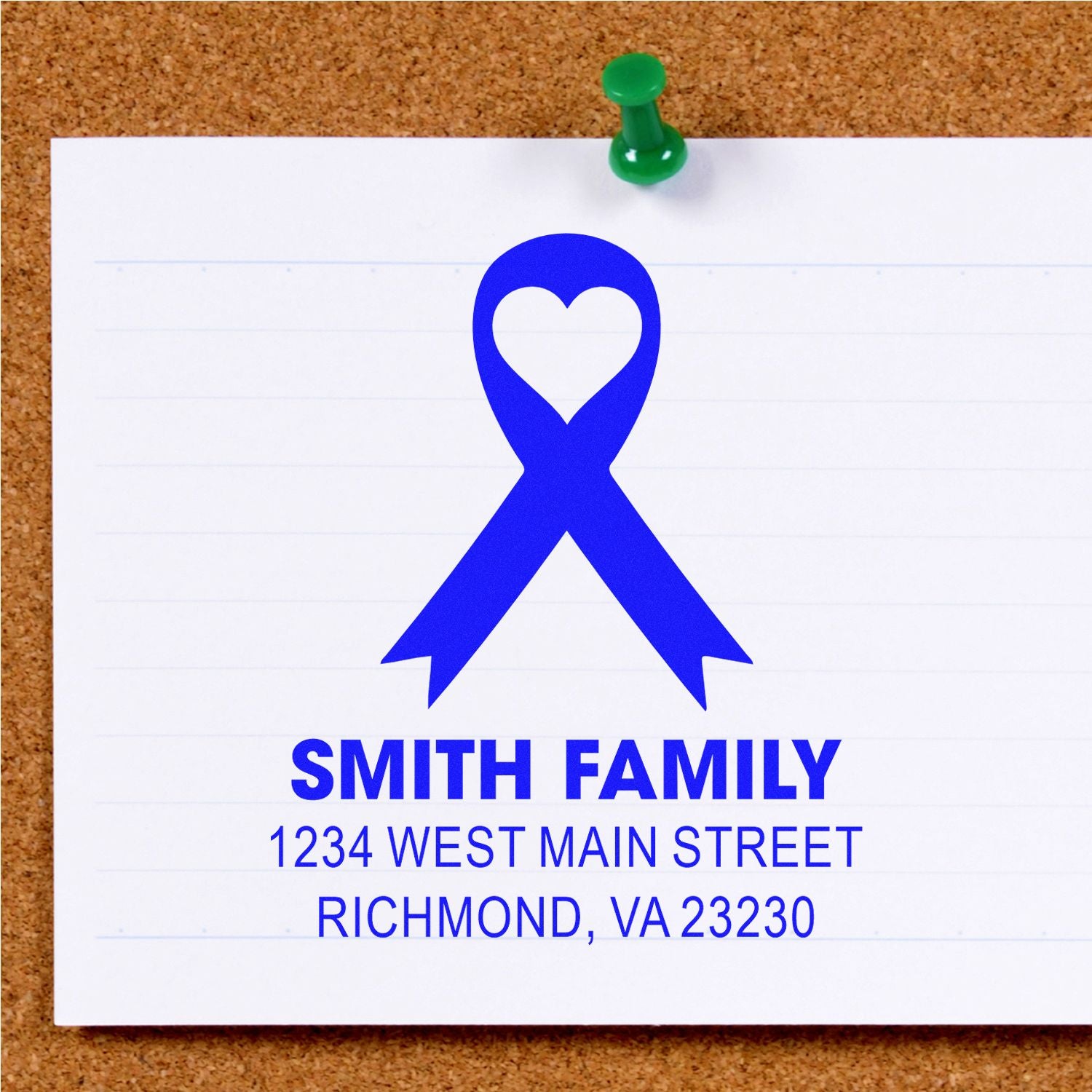 Custom return address rubber stamp with blue awareness ribbon and heart design for Smith Family stationery.