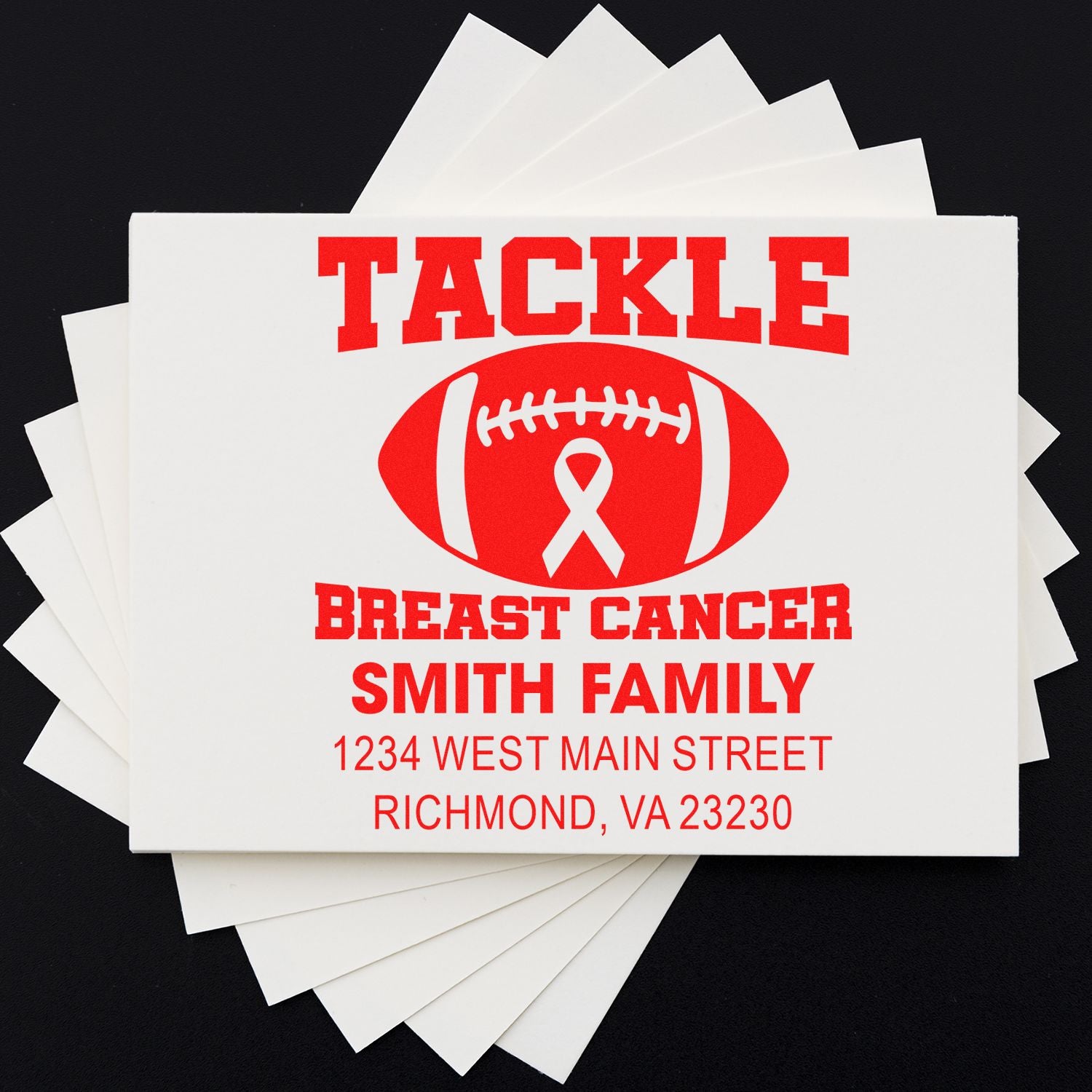 Custom rubber stamp for breast cancer awareness mailings, featuring a football design, Smith family name, and return address.