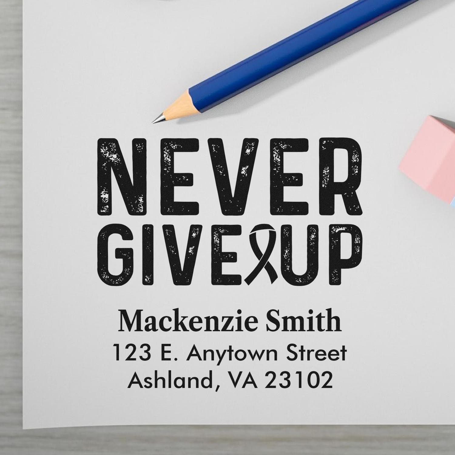 Custom rubber stamp design with Never Give Up ribbon message and personalized name and address for memorial stationery.