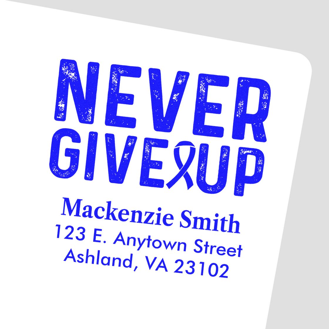 Blue custom rubber stamp with Never Give Up and awareness ribbon, personalized with Mackenzie Smith address.