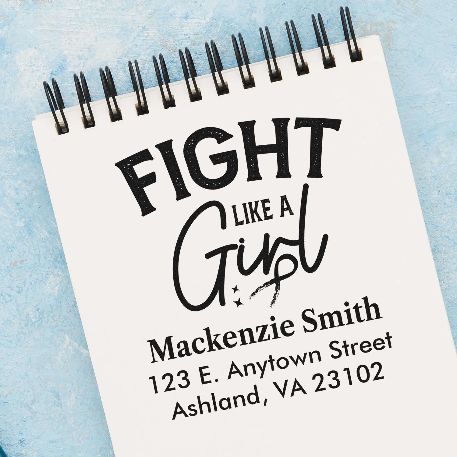 Custom rubber stamp design featuring Fight Like a Girl with personalized name and address for mailing.