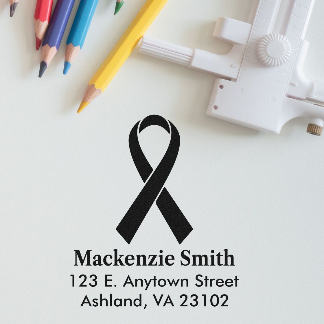 Custom rubber stamp with black awareness ribbon, name, and address for mailing, fundraising, or memorial correspondence.