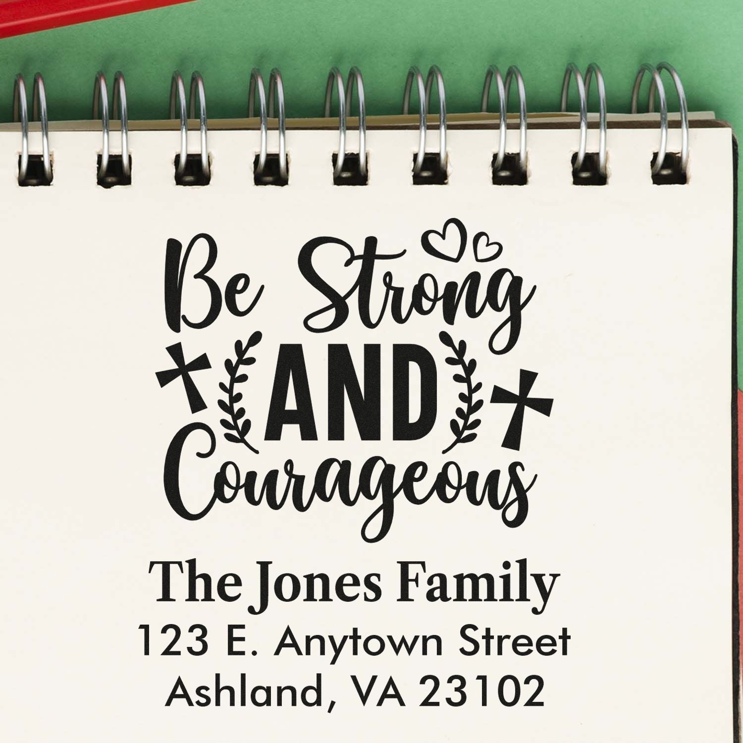 Custom rubber stamp design with Be Strong and Courageous Bible verse, family name, and address for personalized stationery.
