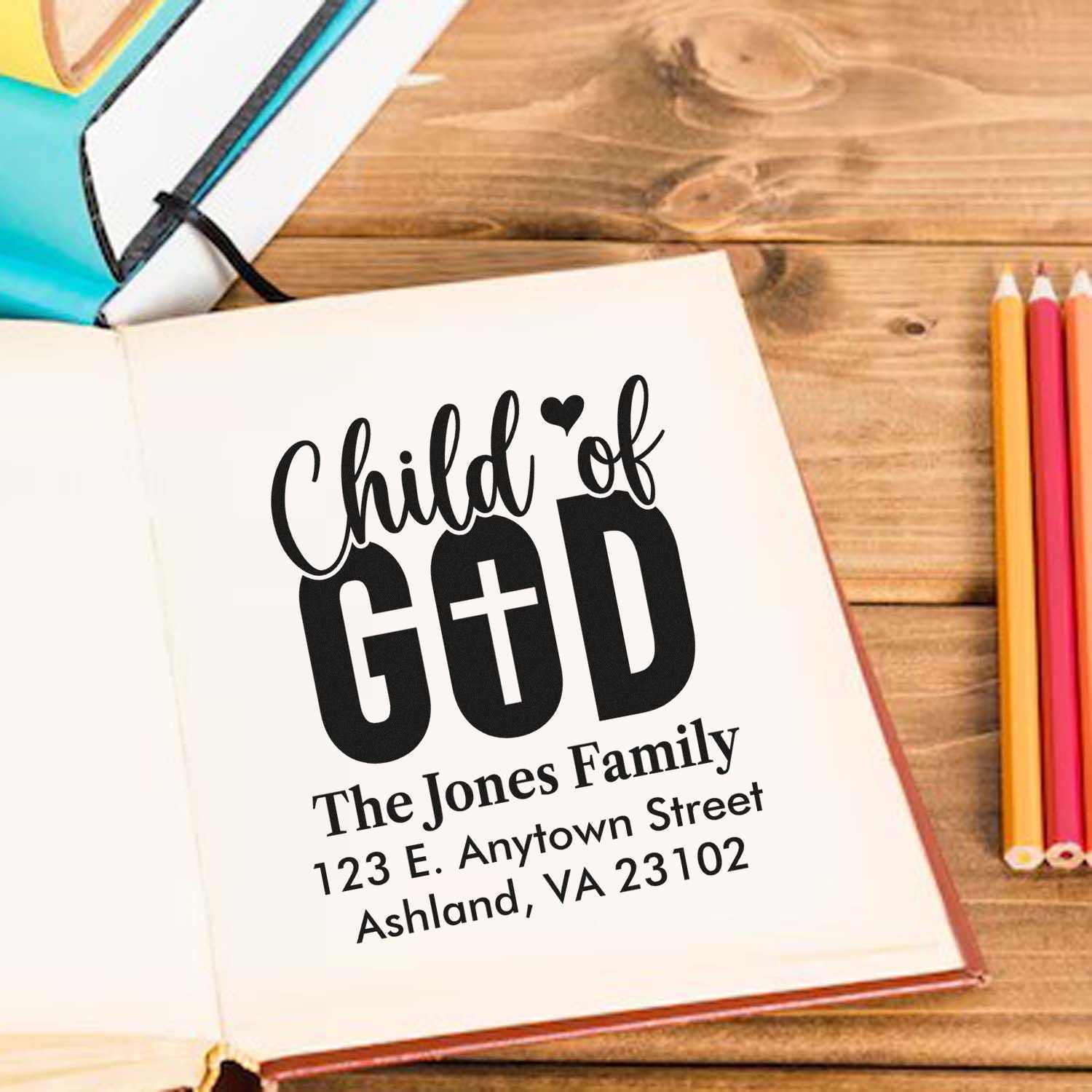 Personalized Child of God rubber stamp mockup with family name and address for custom religious stationery.