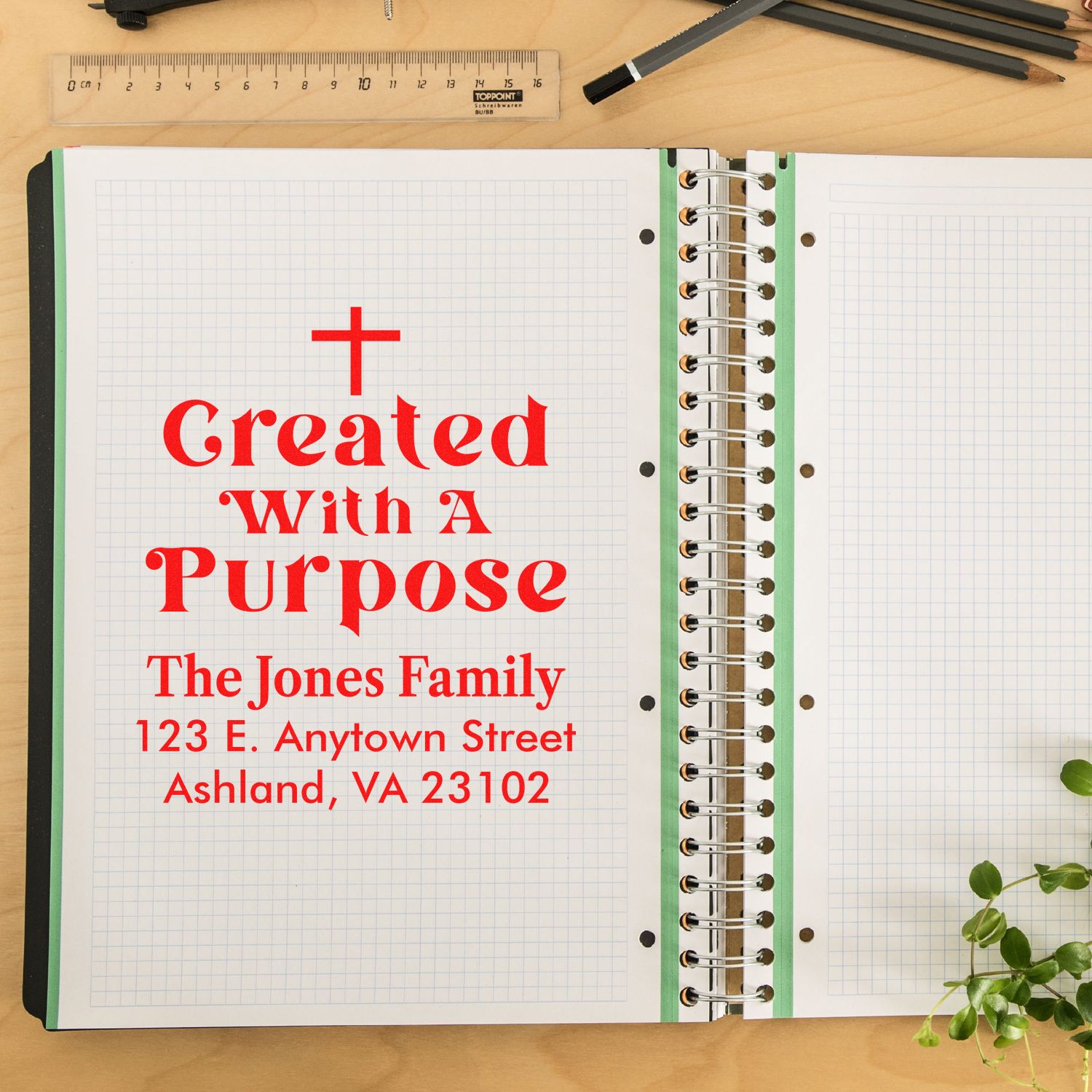 Custom rubber stamp mockup with Created With a Purpose and The Jones Family return address on a spiral notebook page.