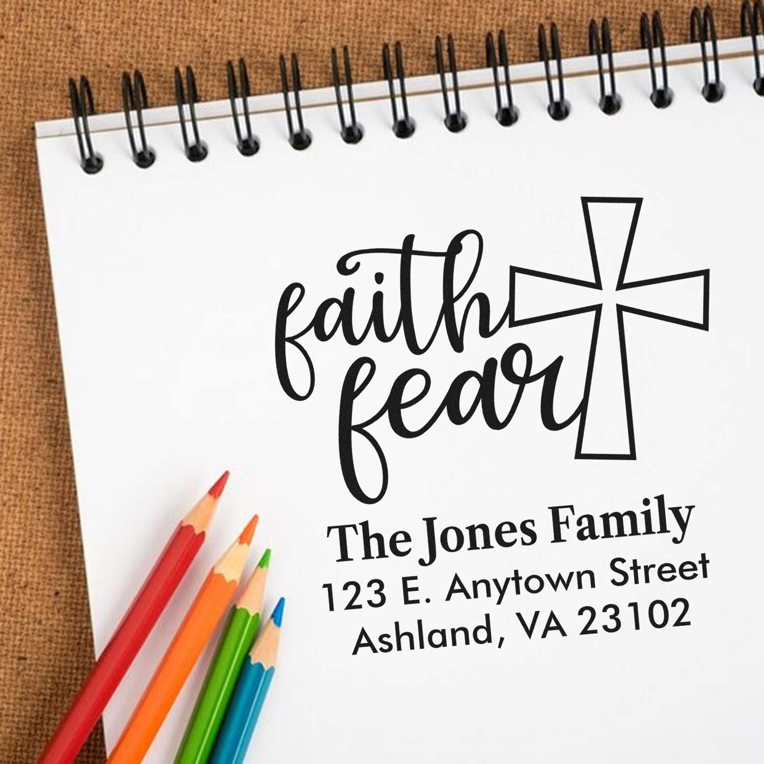 Custom faith fear rubber stamp with cross and family address for personalized stationery and church gifts.