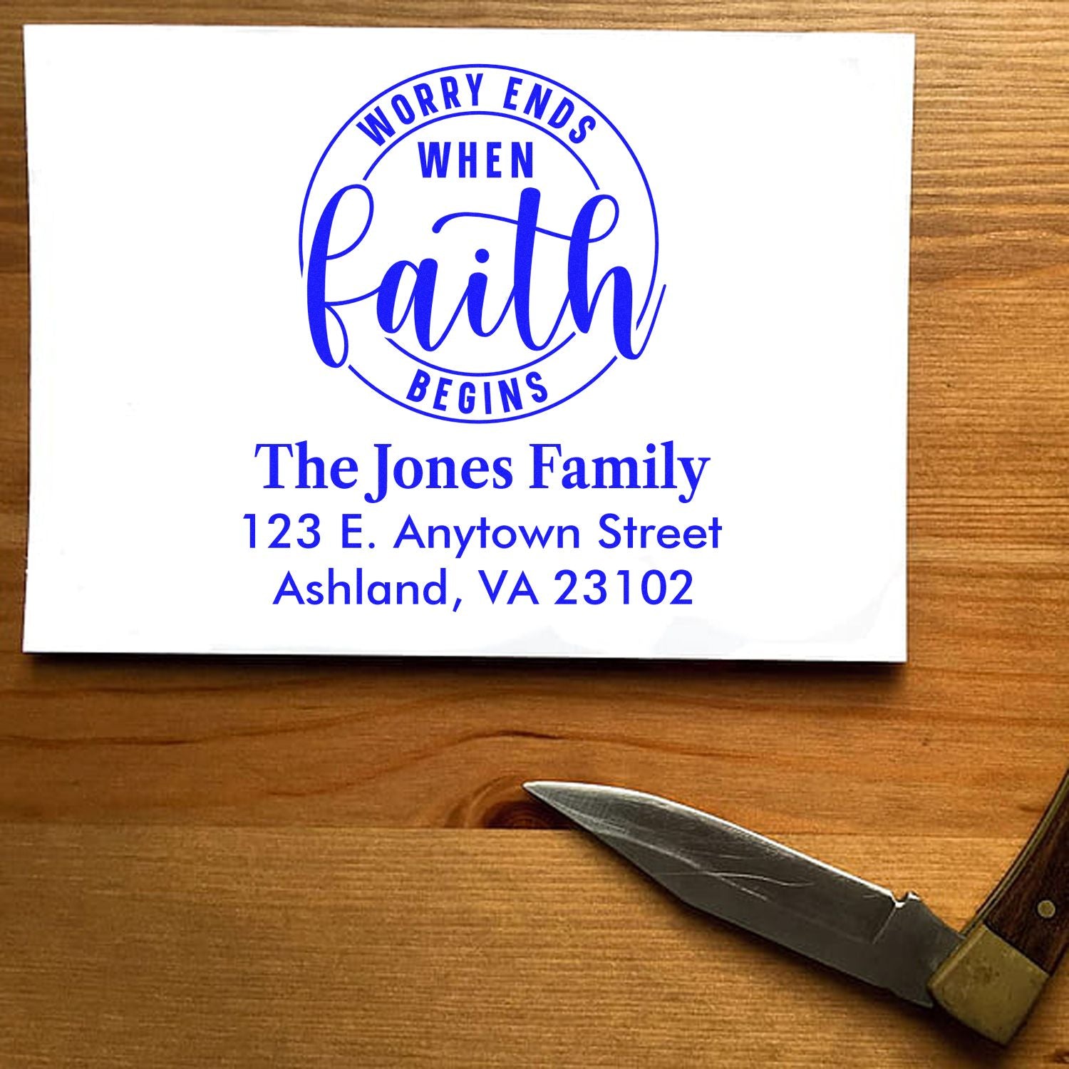 Custom faith-themed return address rubber stamp with Worry Ends When Faith Begins and personalized family address.