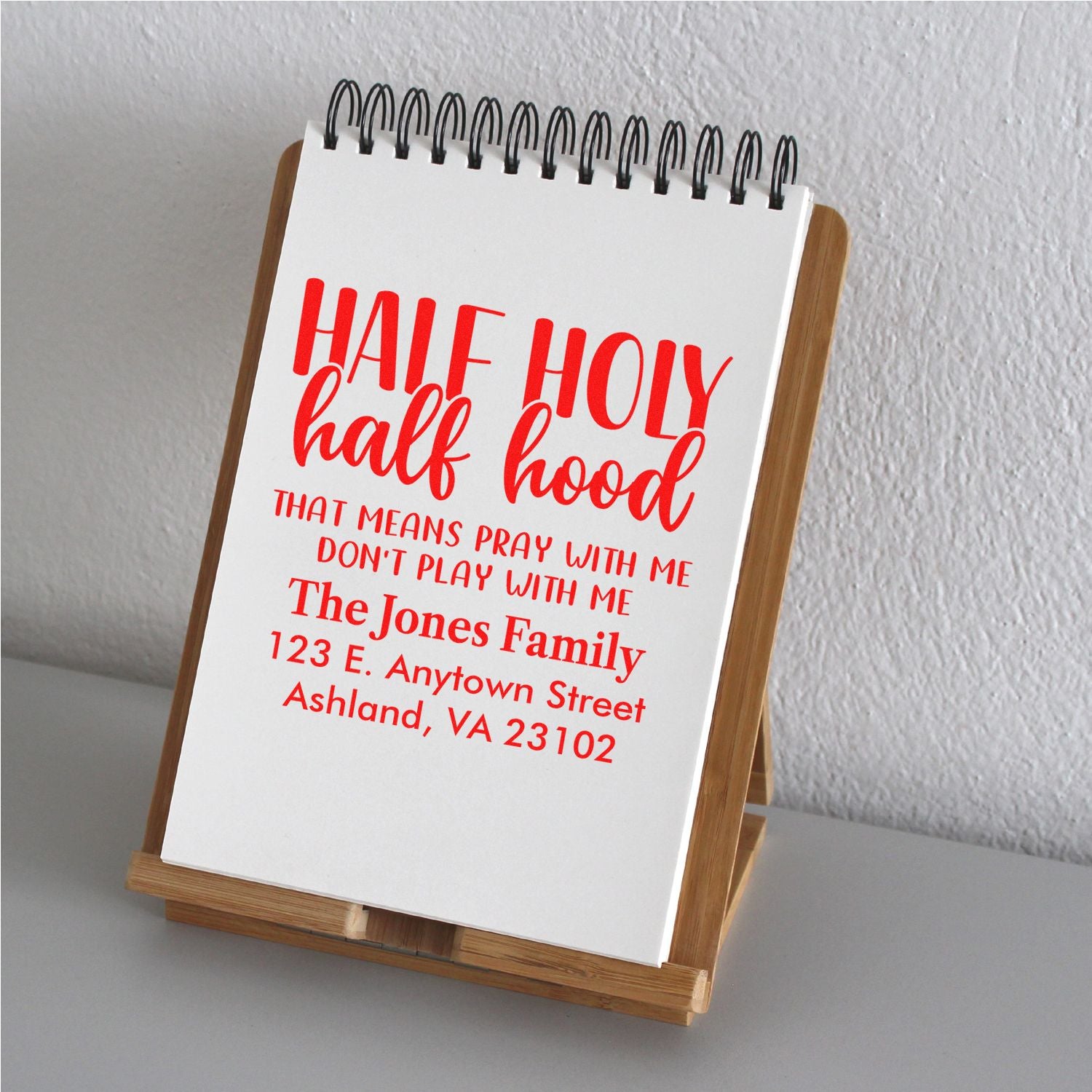 Custom rubber stamp design with Half Holy, Half Hood family name and address for personalized stationery.