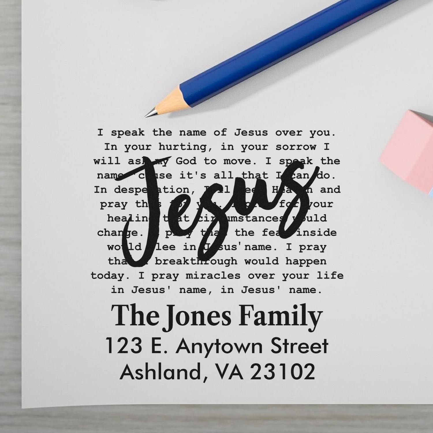 Faith-based custom address rubber stamp proof with handwritten Jesus overlay and family name and mailing address.
