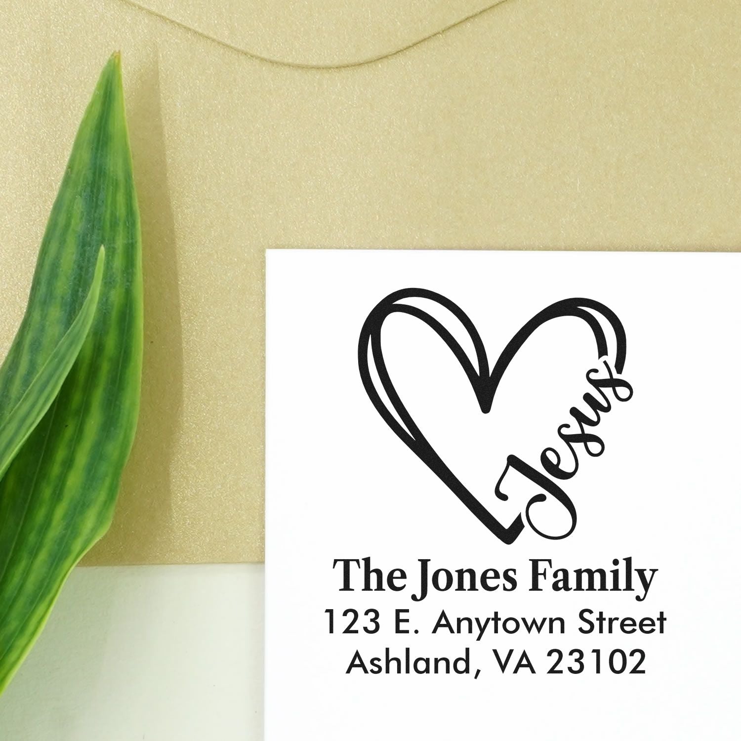 Custom return address rubber stamp with heart design for The Jones Family and mailing address.