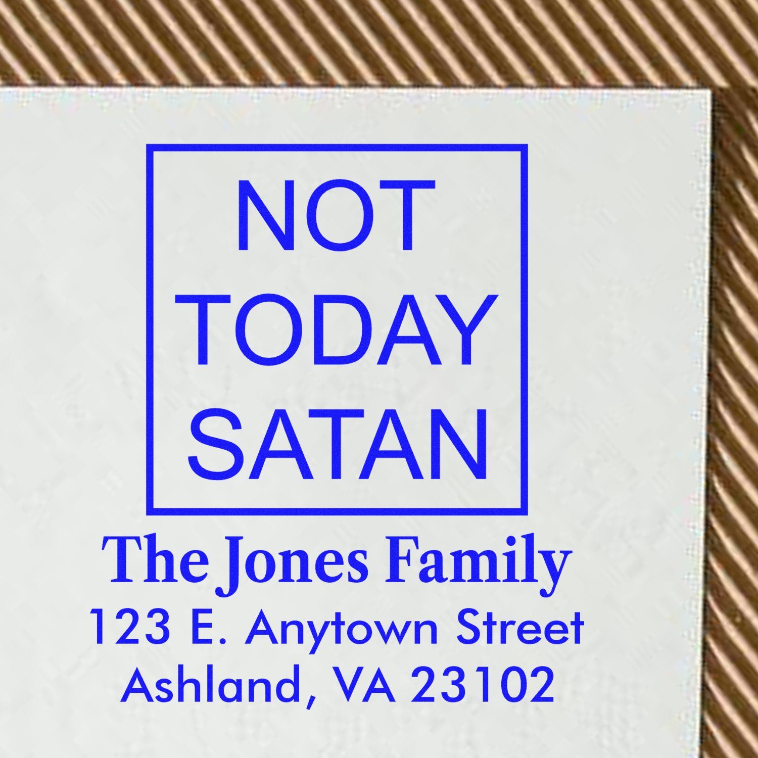 Custom return address rubber stamp with Not Today Satan slogan, family name, and address in blue.