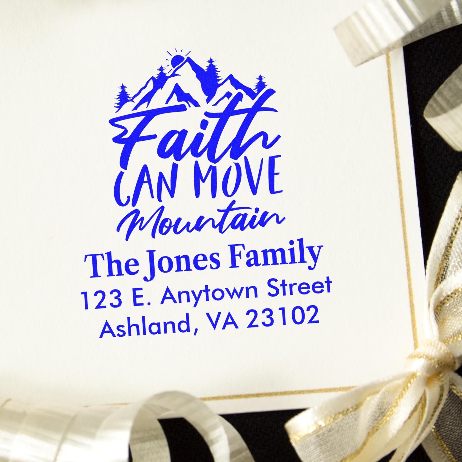 Custom rubber stamp with mountain graphic, faith quote, and family address for personalized stationery or gift packaging.