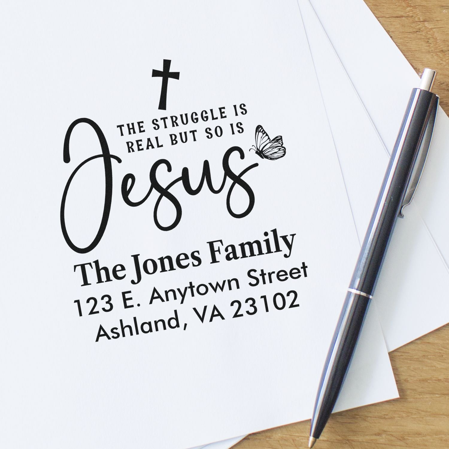 Personalized Christian return address rubber stamp for The Jones Family with cross, butterfly, and faith quote.