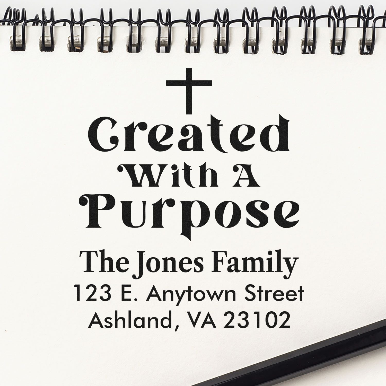 Custom rubber stamp proof with cross and Created With a Purpose, featuring family name and address for a personalized faith stamp.