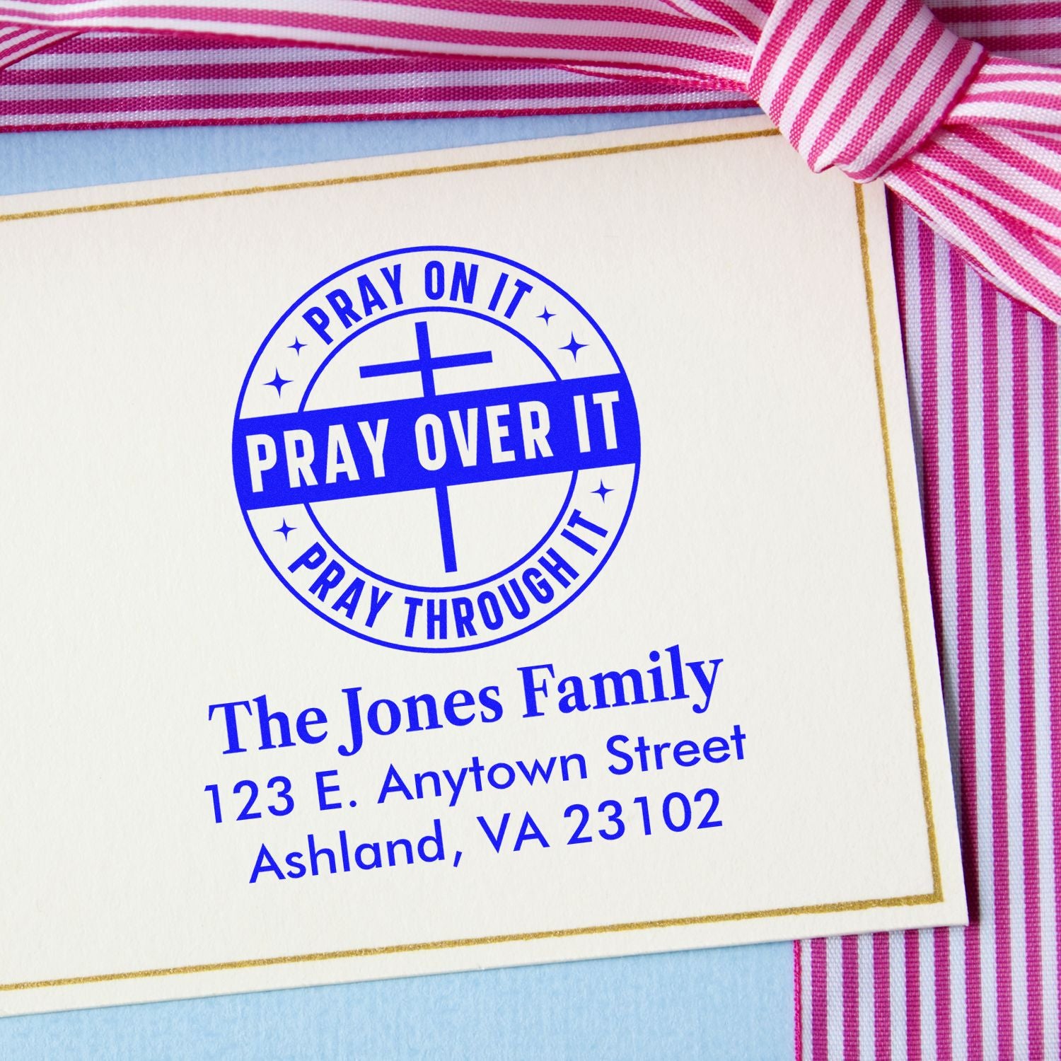 Custom rubber stamp design with prayer message and family return address for personalized stationery.
