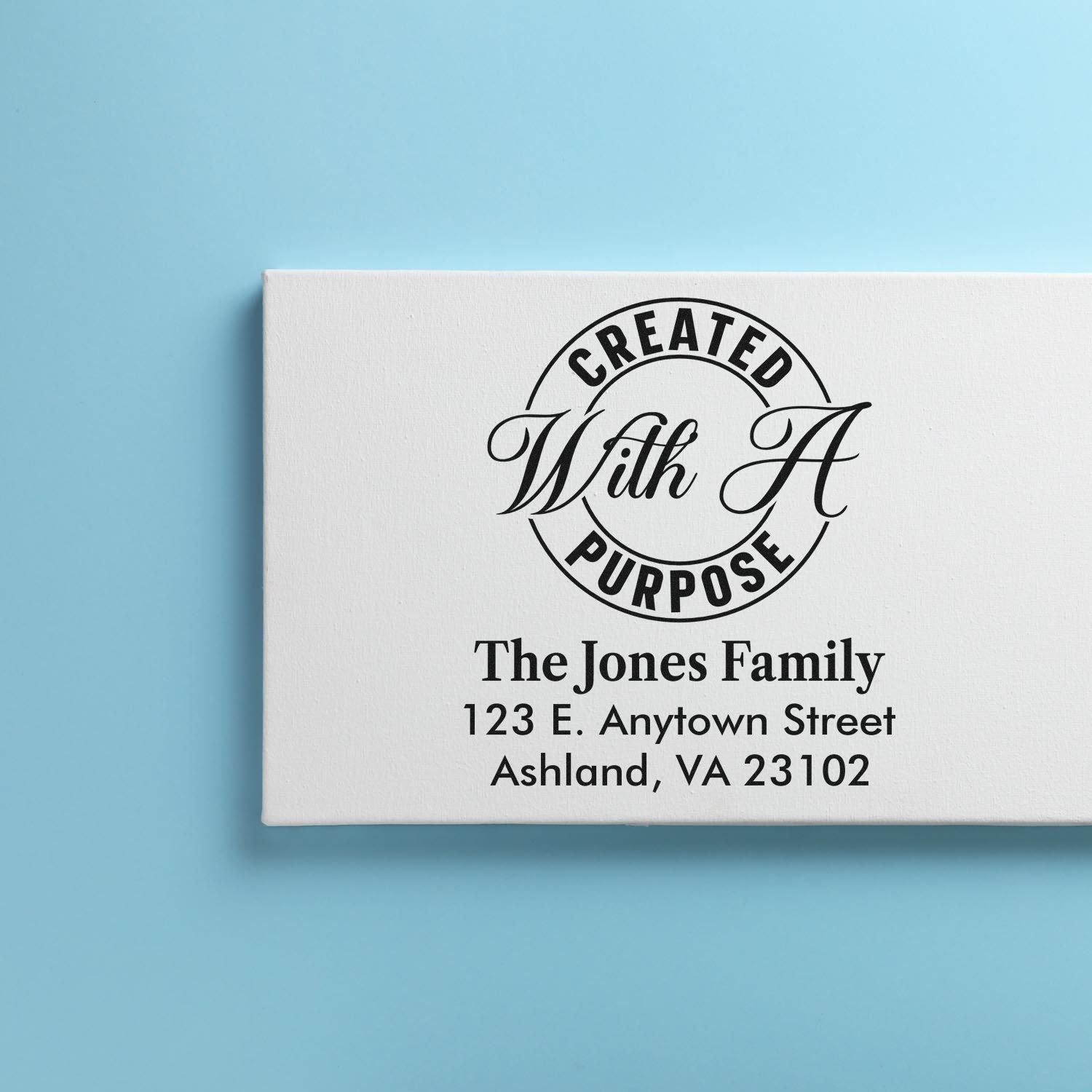 Custom rubber address stamp with Created With Purpose logo and The Jones Family return address for Ashland, VA.