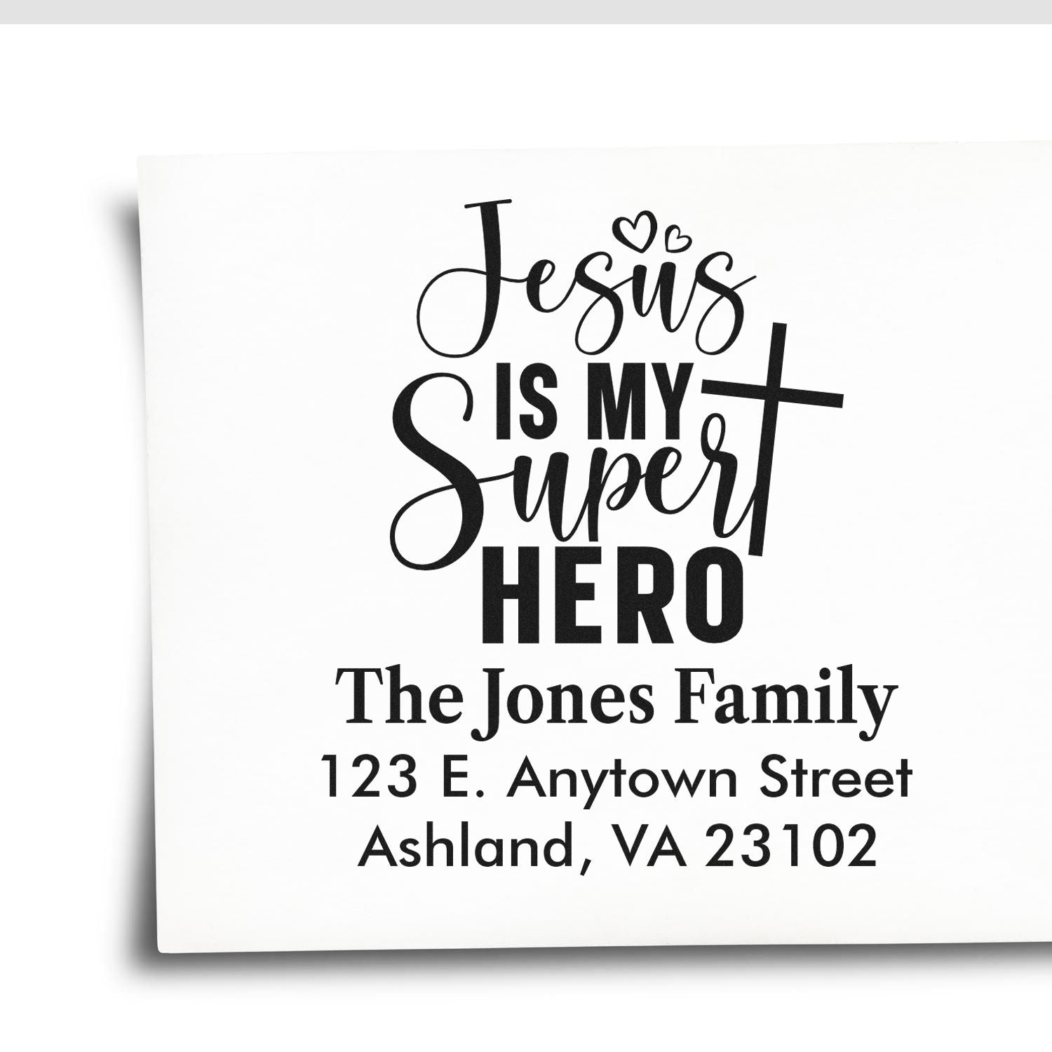 Personalized Christian address rubber stamp with Jesus Is My Super Hero design, family name, and address for religious mailing.