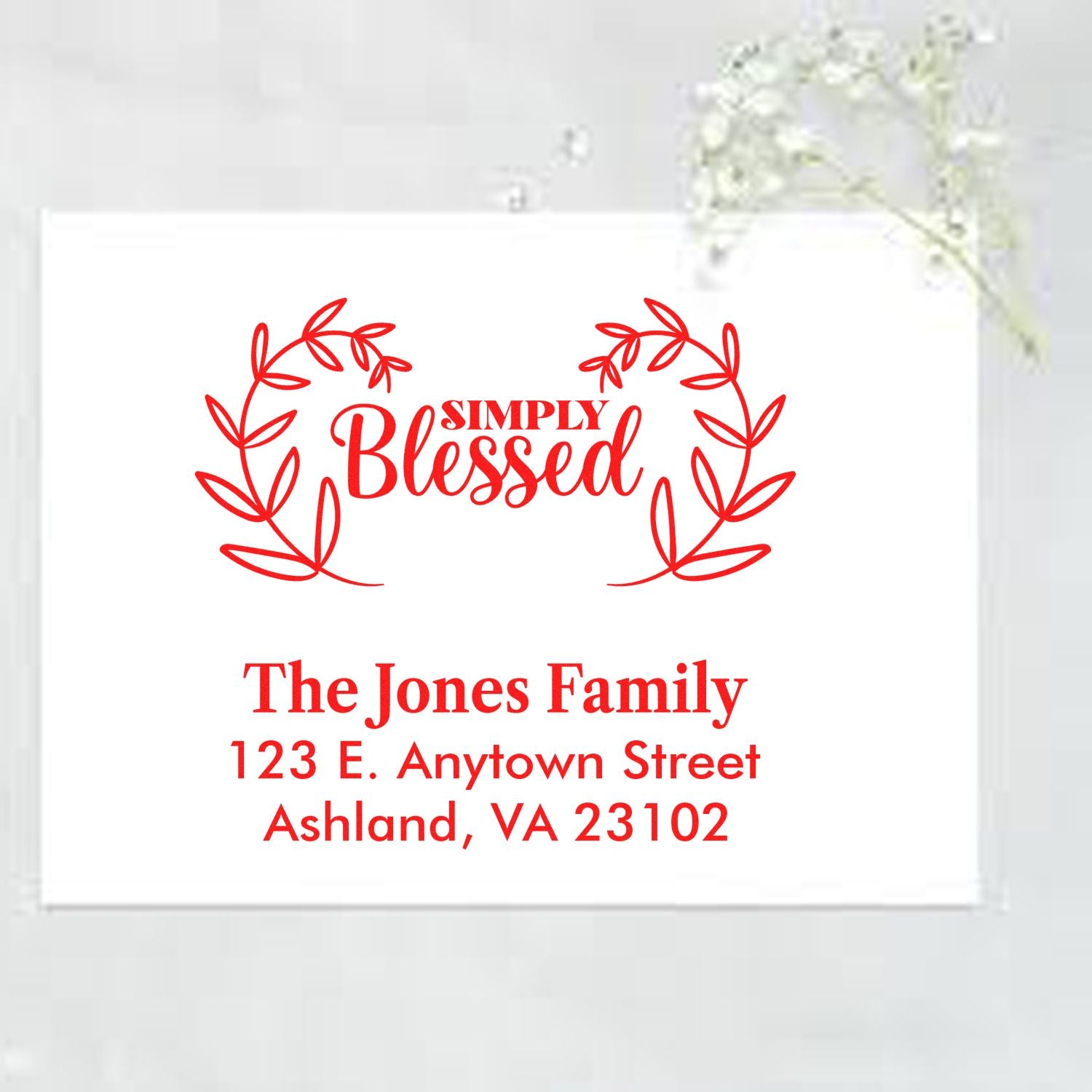 Custom return address rubber stamp with Simply Blessed wreath, The Jones Family, and Ashland, VA mailing details.